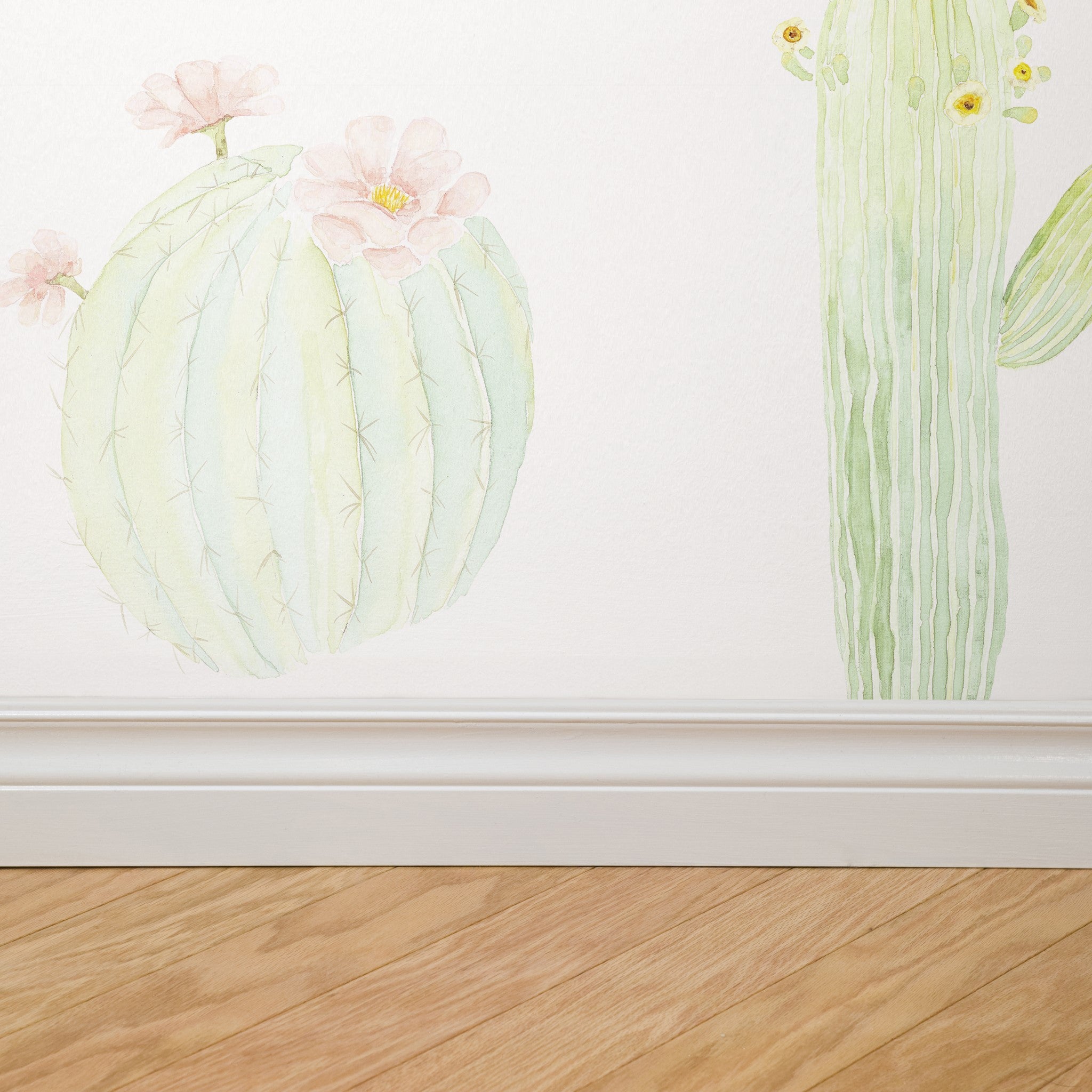 "Wall Blush 'Petals and Prickles (Small)' wallpaper featured in modern room, highlighting botanical design focus."