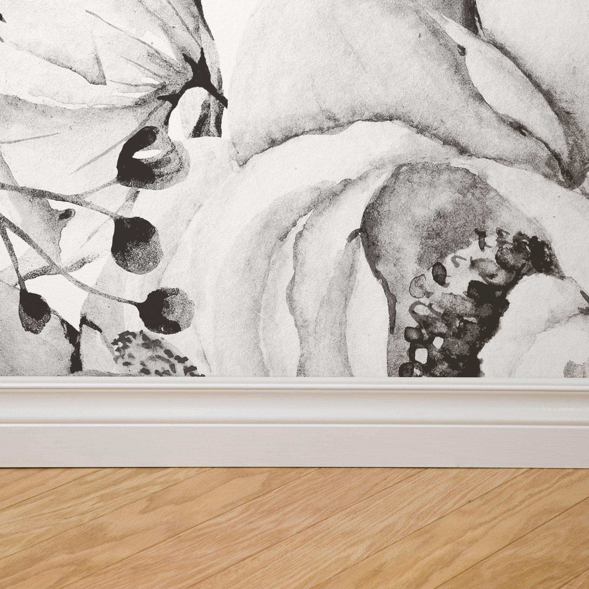 "Wall Blush's Juliet (Dark) Wallpaper elegantly adorns the wall of a modern living space, highlighting artistic design."