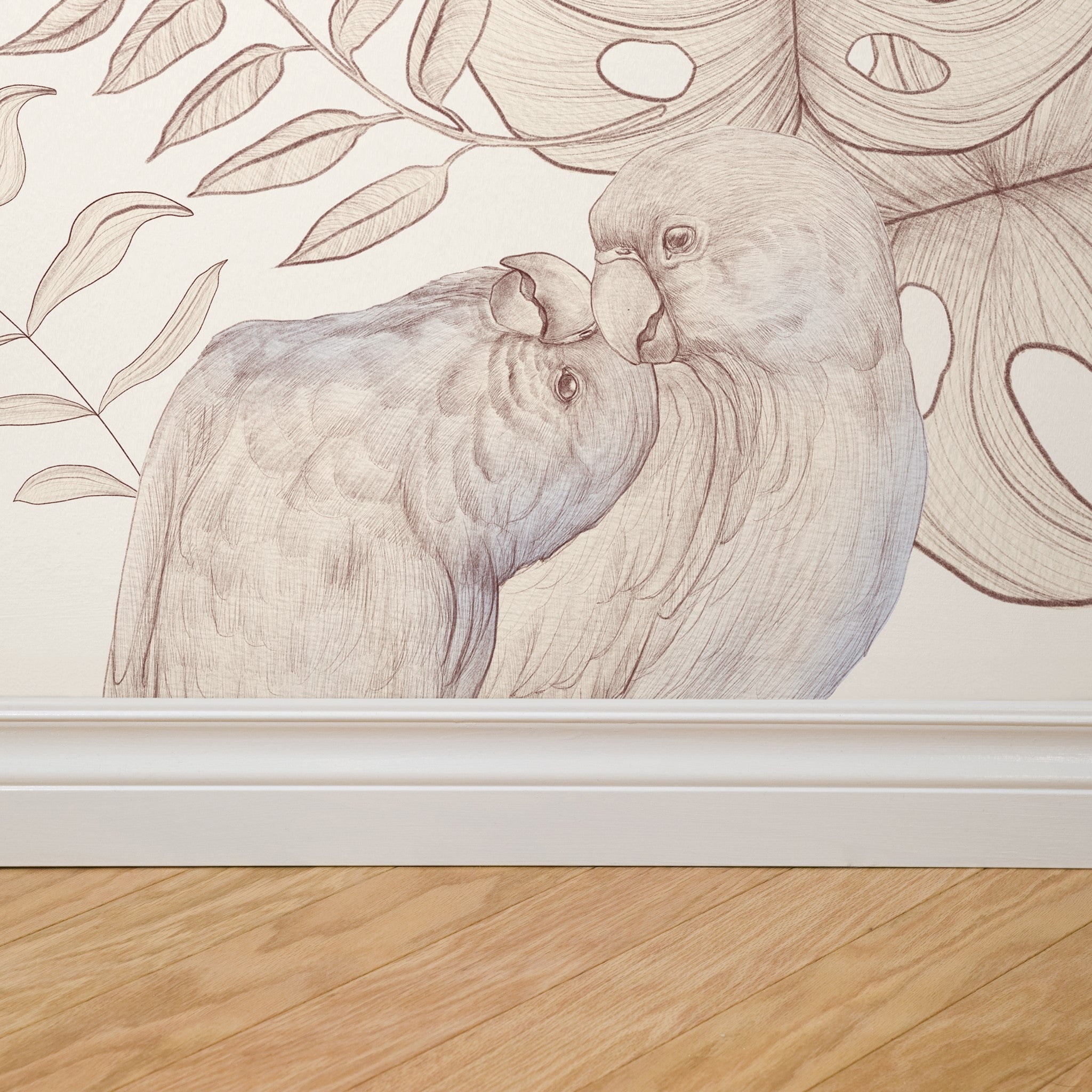 "Odette Wallpaper by Wall Blush with elegant bird design in a cozy living room setting, detailed texture focus."