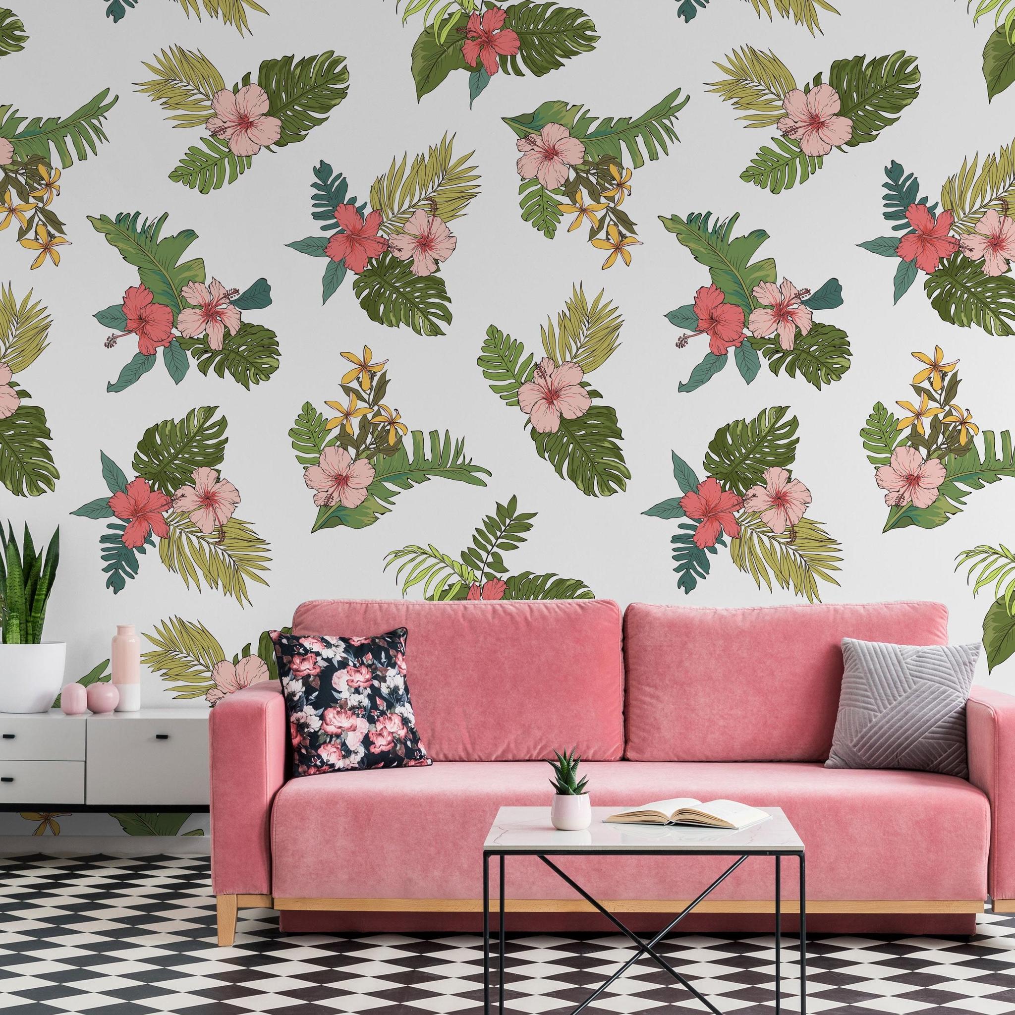 Mahalo Wallpaper by Wall Blush SG02 highlights tropical patterns in a chic living room setting with pink sofa.