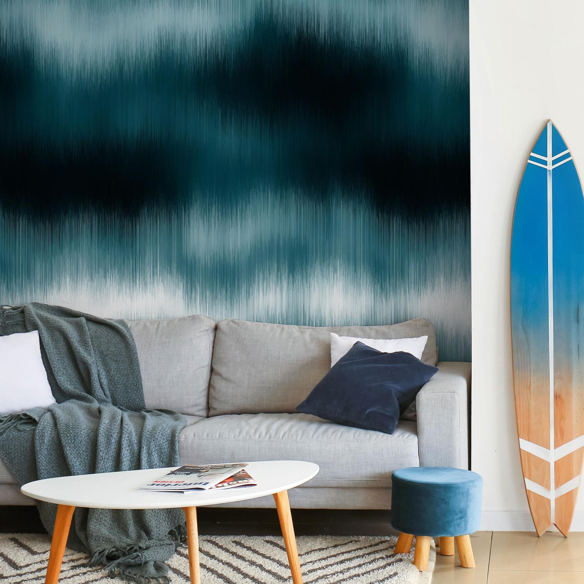 Wall Blush's Oceanside Wallpaper enhancing the cozy living room decor with a modern coastal vibe.