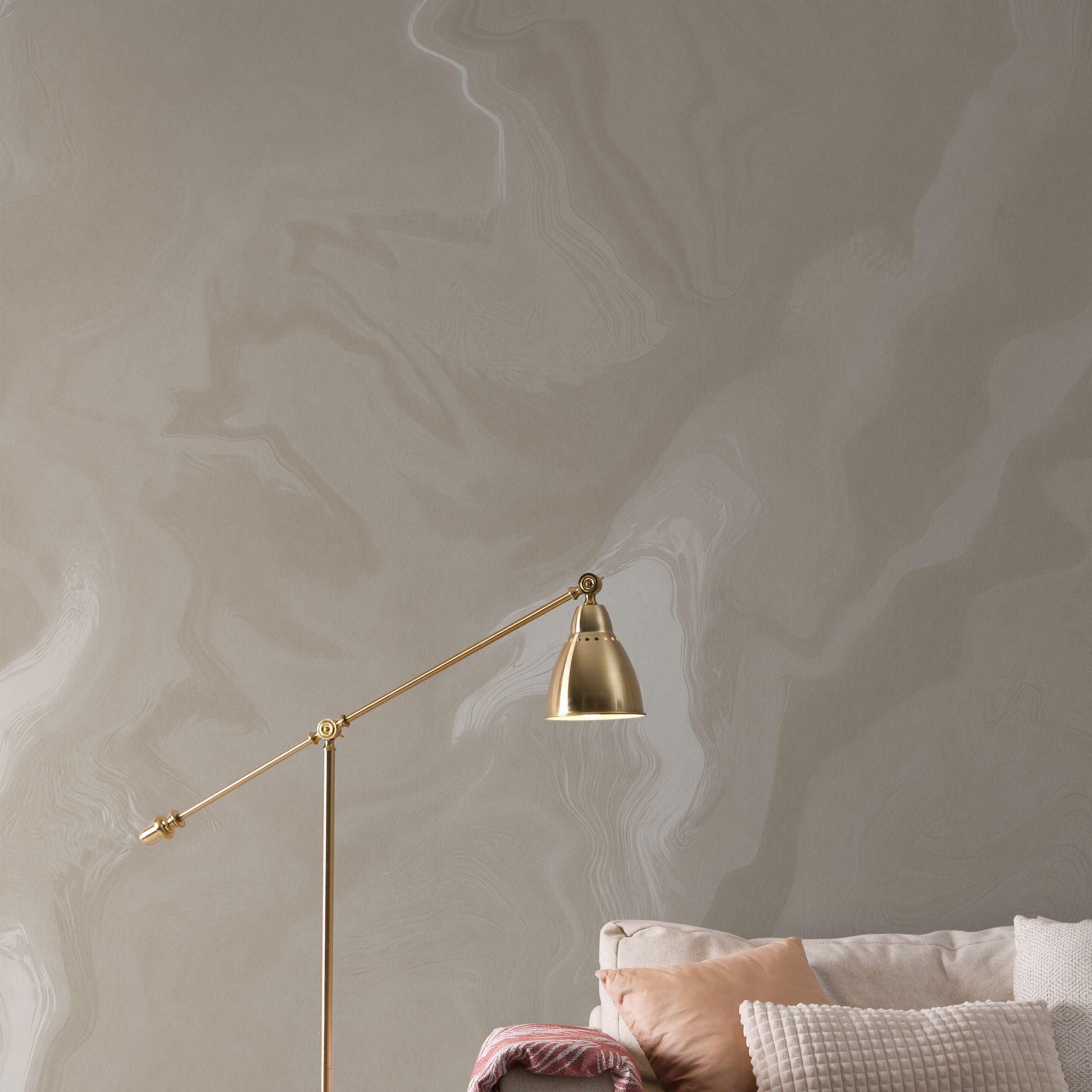 Whisper Wallpaper by The Stefanie Bloom Line showcased in a cozy living room setting, highlighting wall texture.