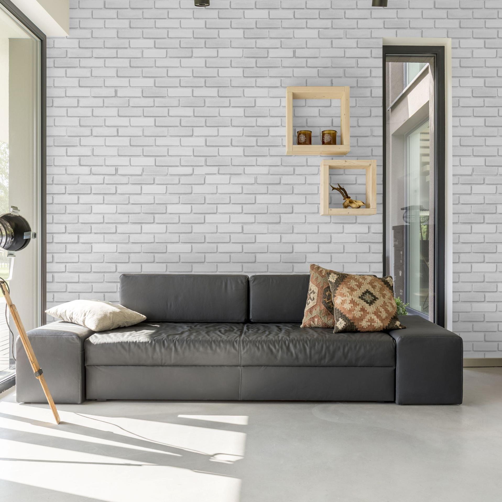 Bella Brick (White) Wallpaper by Wall Blush featured in a modern living room with natural light.