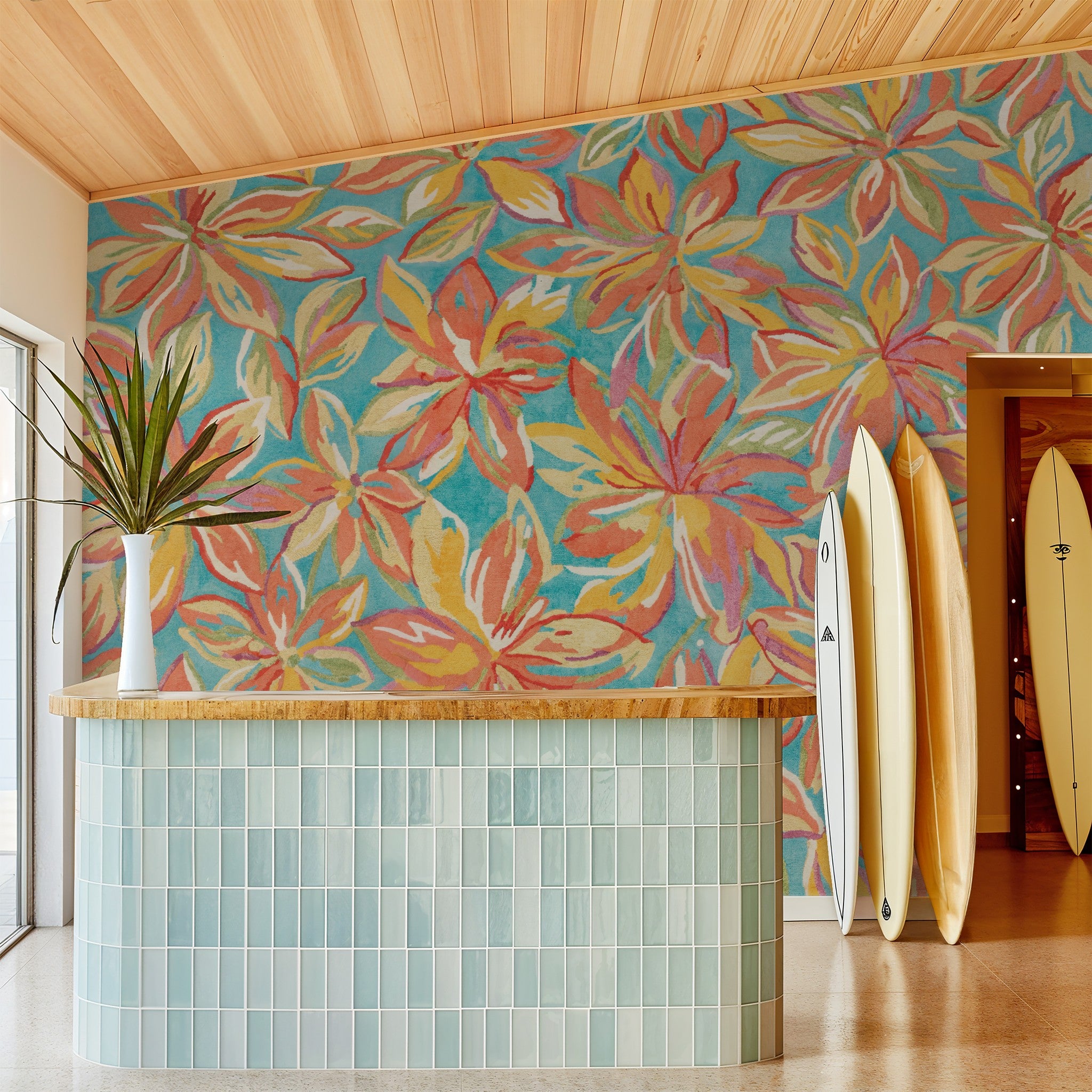 Colorful floral wallpaper with aqua backdrop in a surf-themed room.
