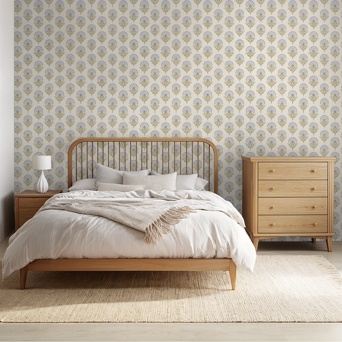 Bedroom with classic blue floral wallpaper and wooden furniture.