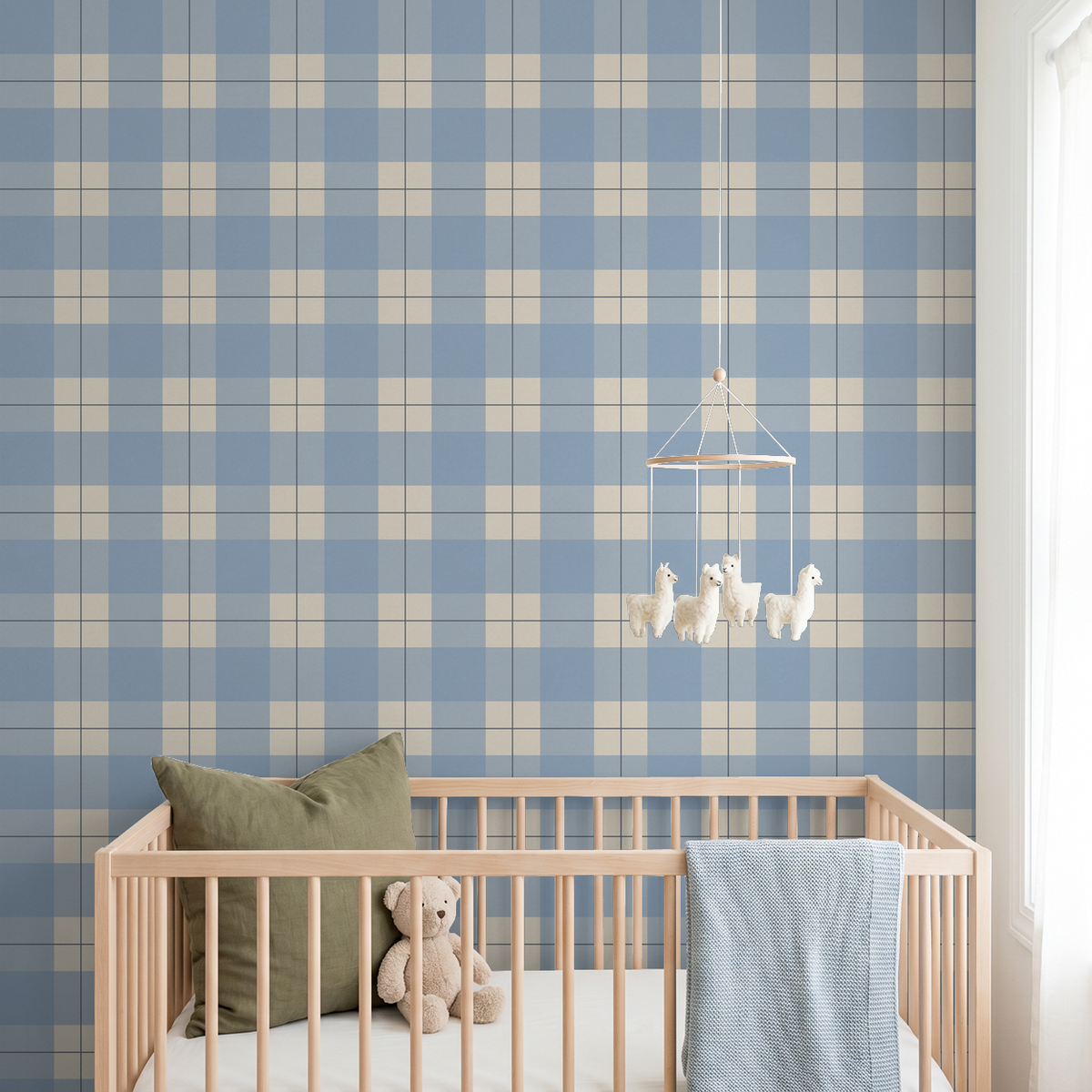 Blue and ivory plaid wallpaper in a nursery with wooden crib and teddy bear.