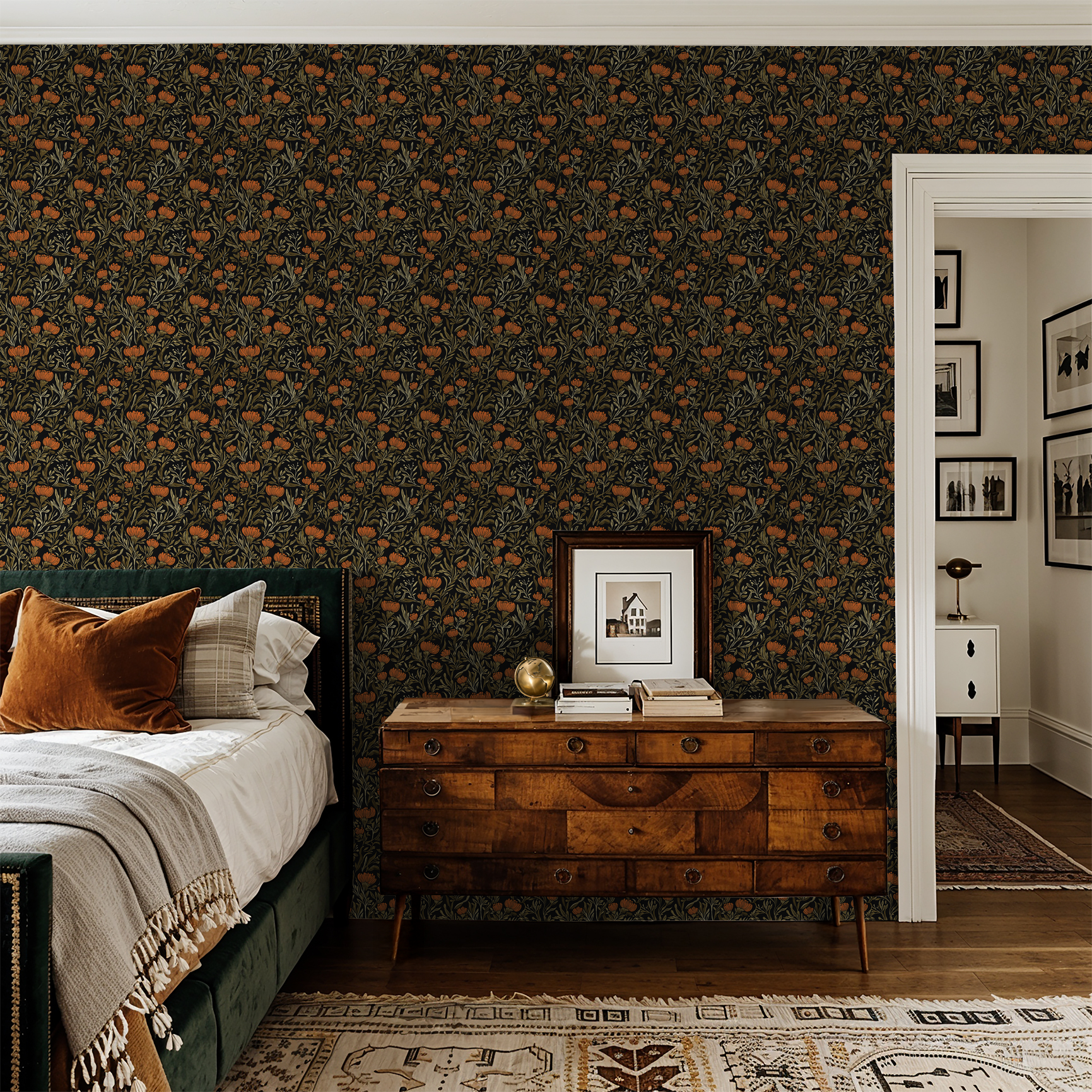 Bold orange floral wallpaper in a cozy bedroom with vintage decor.