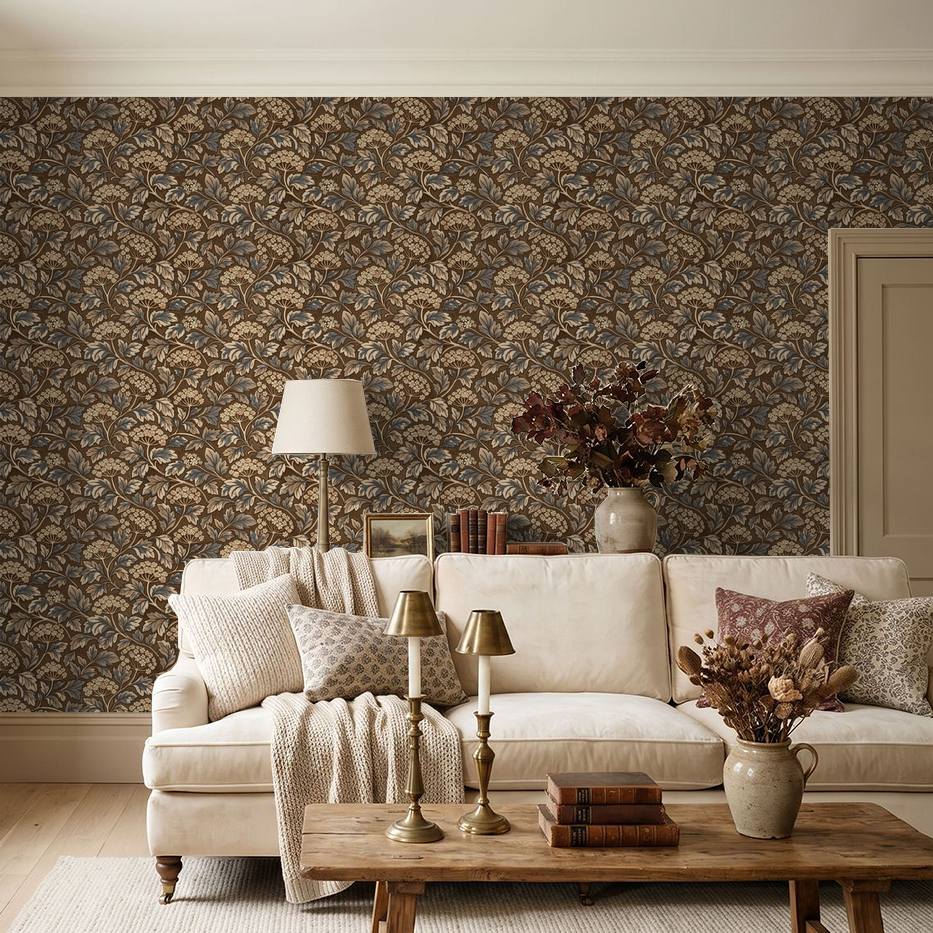 Elegant brown and blue floral wallpaper in cozy living room with beige sofa and decor.