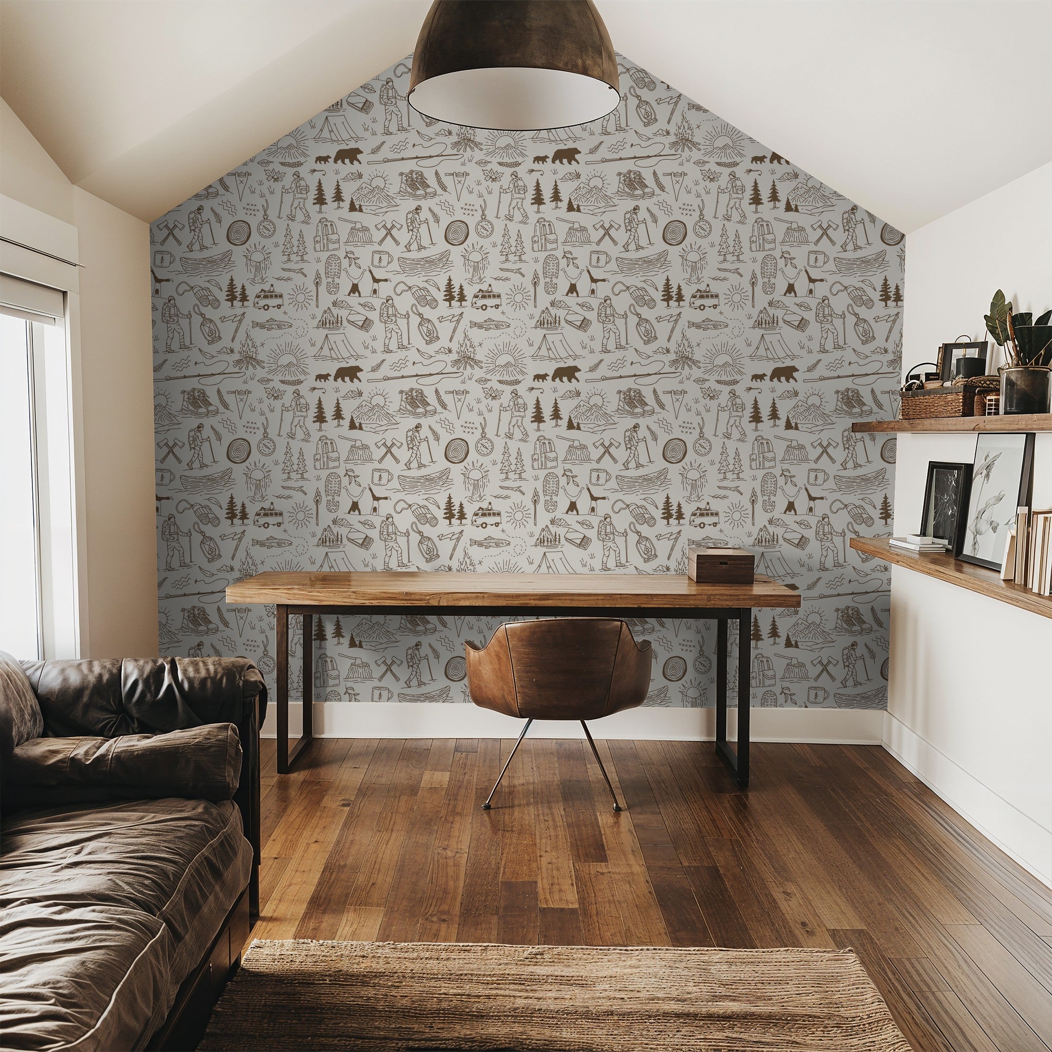 Brown and cream adventure-themed wallpaper in a rustic office setting.