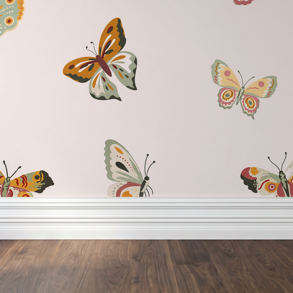 Butterfly wallpaper with colorful patterns on cream background above wood floor.