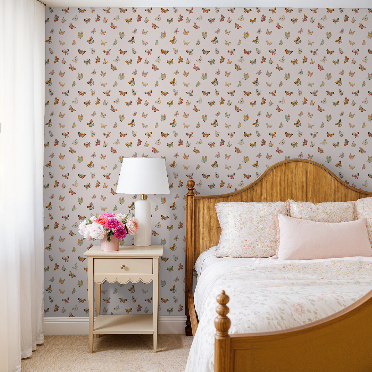 Butterfly wallpaper in cream bedroom with wood bed and floral bedding.