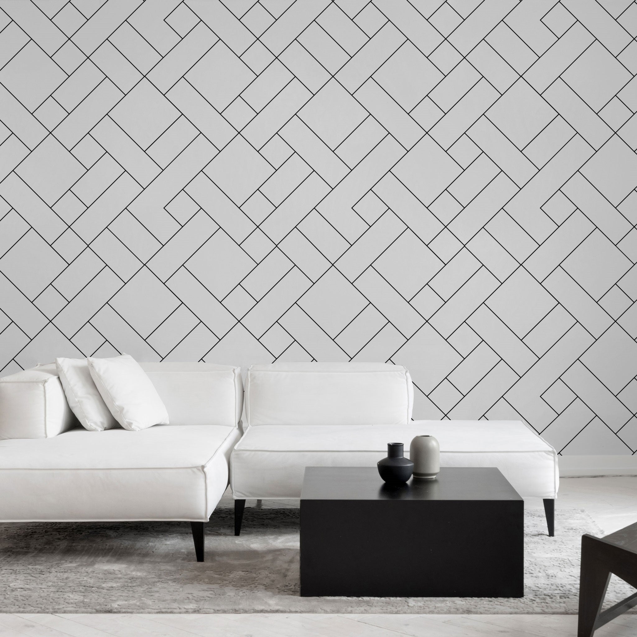 "Wall Blush's Check Mate Wallpaper showcasing in a modern living room, highlighting geometric design focus."