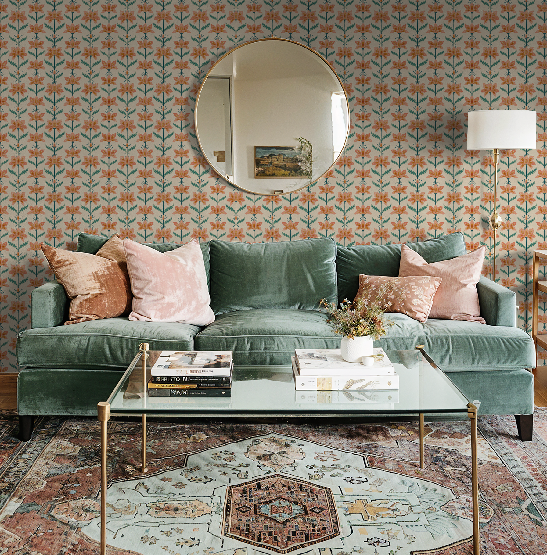Coral floral wallpaper in living room with green sofa and glass coffee table.