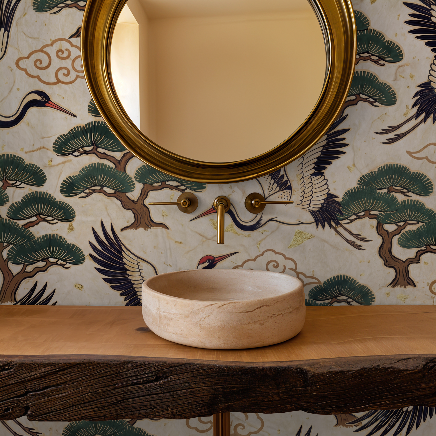Elegant crane and pine tree wallpaper in a bathroom with round mirror and stone sink.