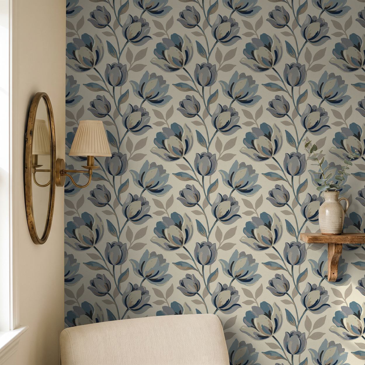 Elegant blue floral wallpaper in a cozy living room with a mirror and vase.