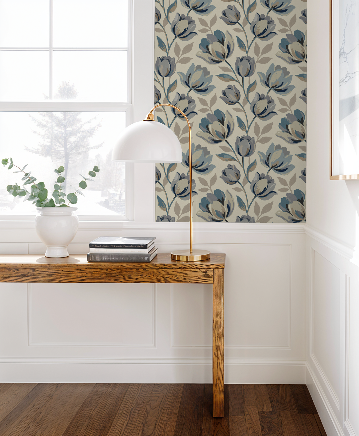 Elegant blue floral wallpaper in a modern living room with wooden table and lamp.