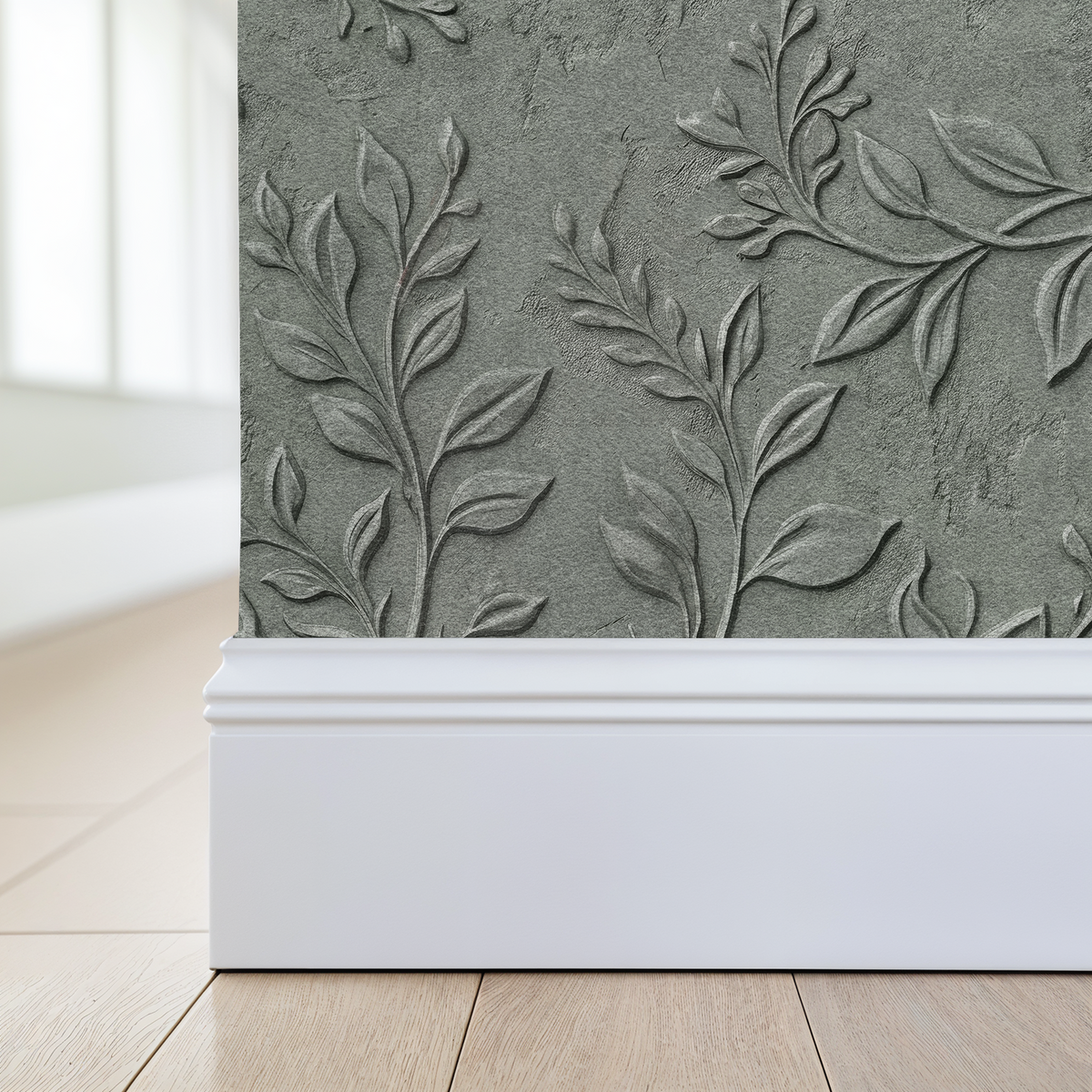 Elegant grey wallpaper with embossed leaf and vine patterns in a modern room setting.