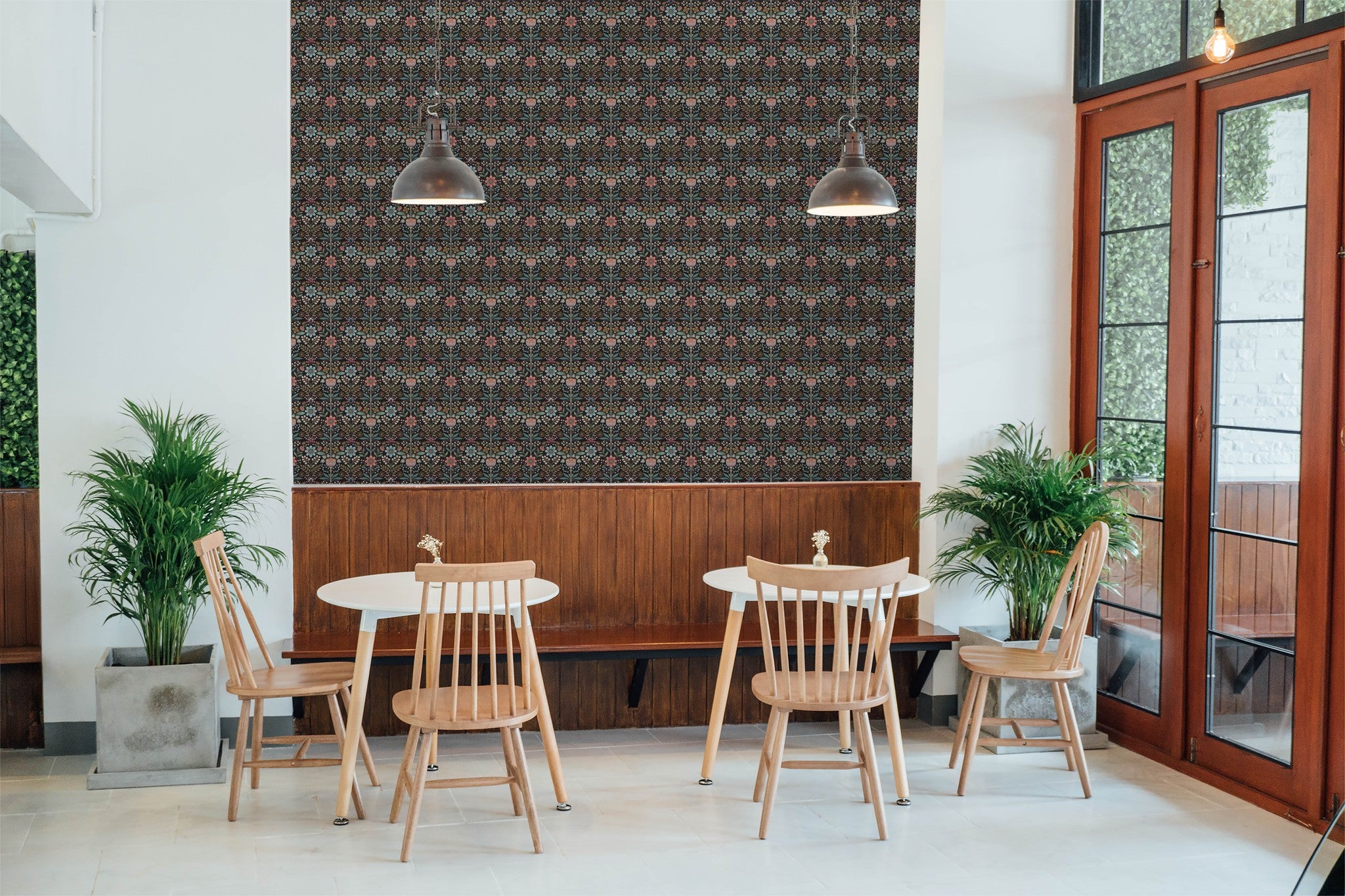 Floral wallpaper with pink, blue flowers on black in modern dining room.