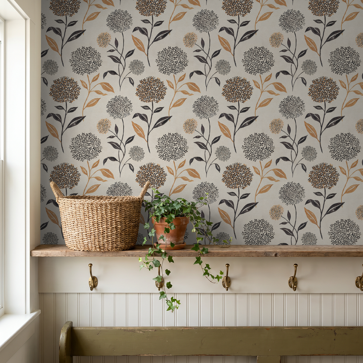 Floral wallpaper with terracotta and charcoal blooms on ivory backdrop in rustic room.