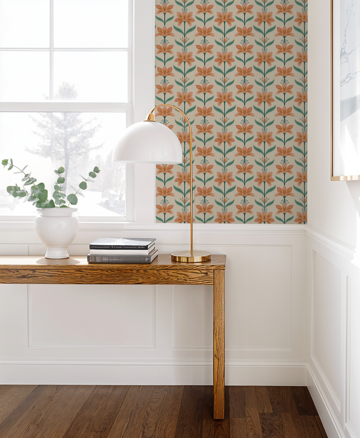 Gardenza wallpaper with coral flowers and teal leaves in a bright living room setting.