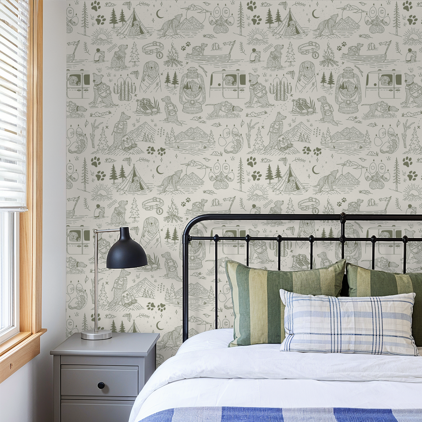 Green and cream dog-themed adventure wallpaper in cozy bedroom setting.
