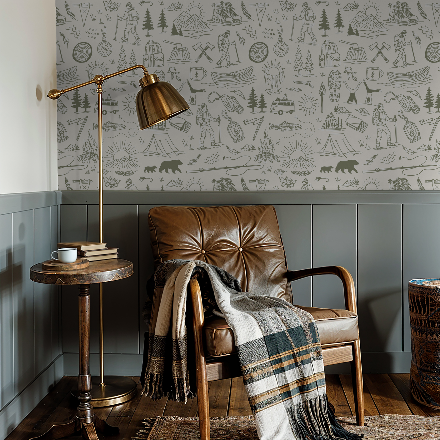 Green and cream nature-themed wallpaper in cozy reading nook with leather chair and lamp.