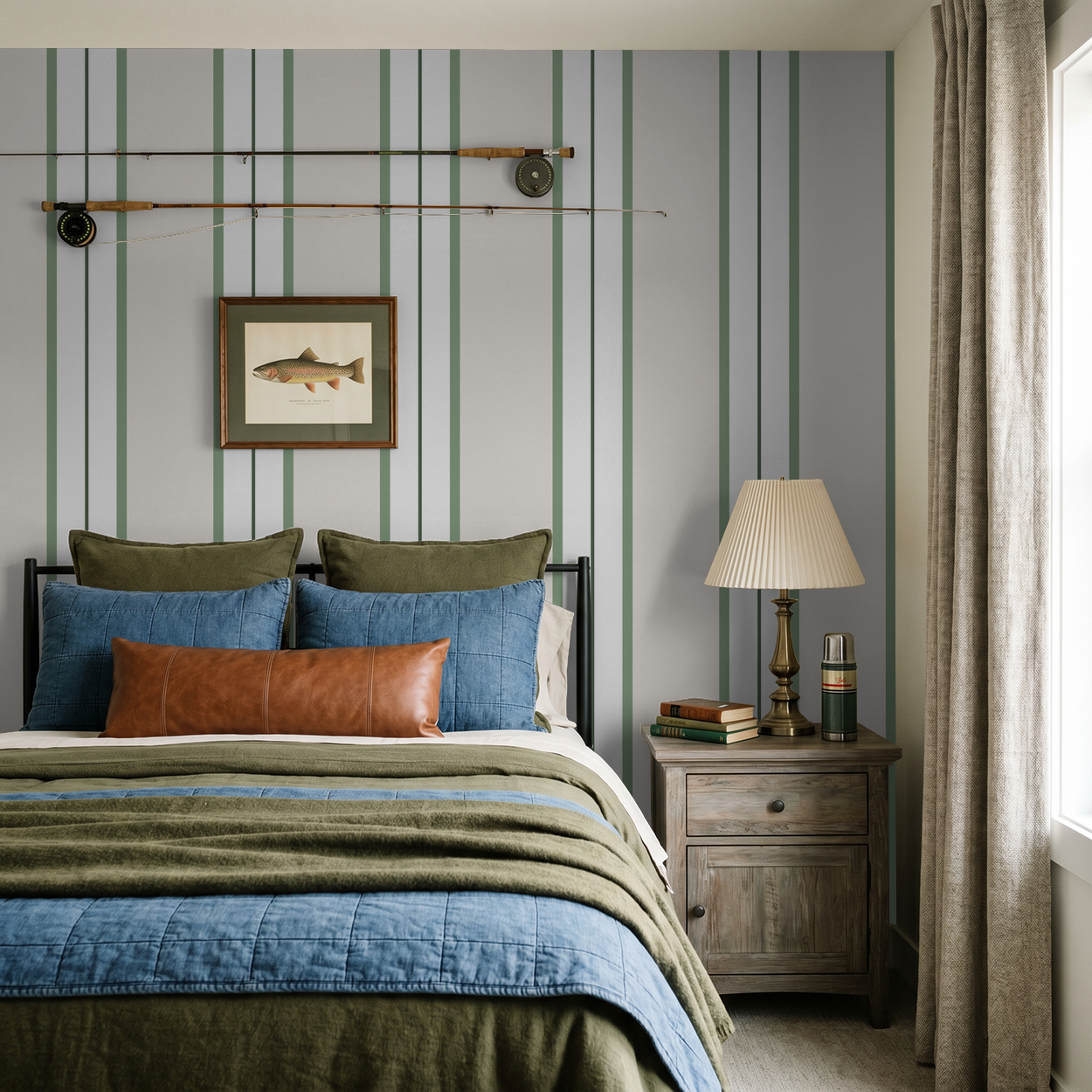 Bedroom with green striped wallpaper, cozy bedding, and wooden nightstand.