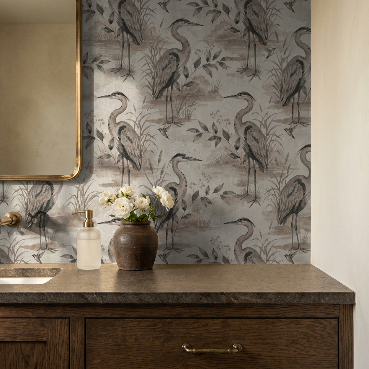 Heron Lake wallpaper with herons and foliage in taupe and sepia in a bathroom setting.