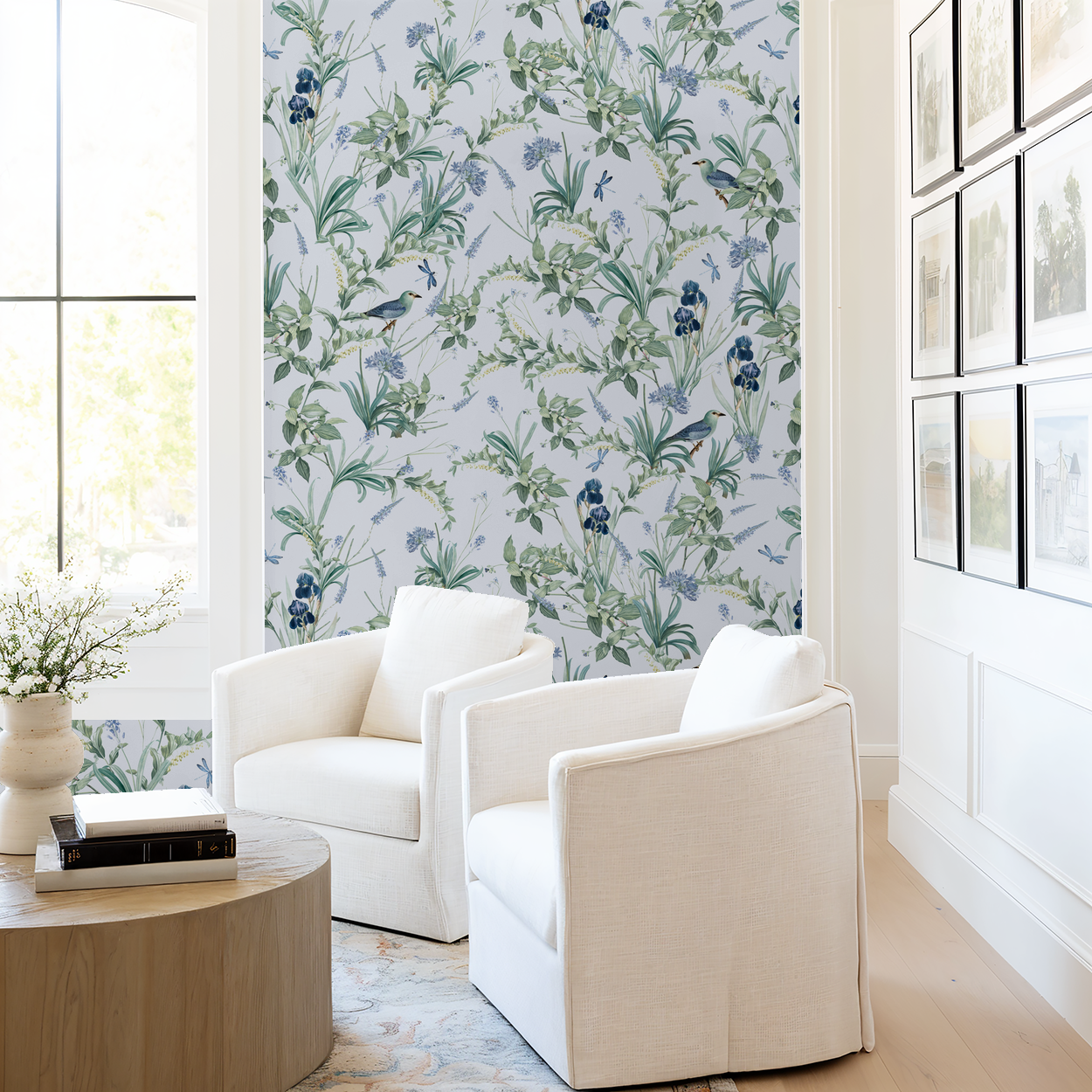 Lavender floral wallpaper with birds in a bright living room with white chairs.
