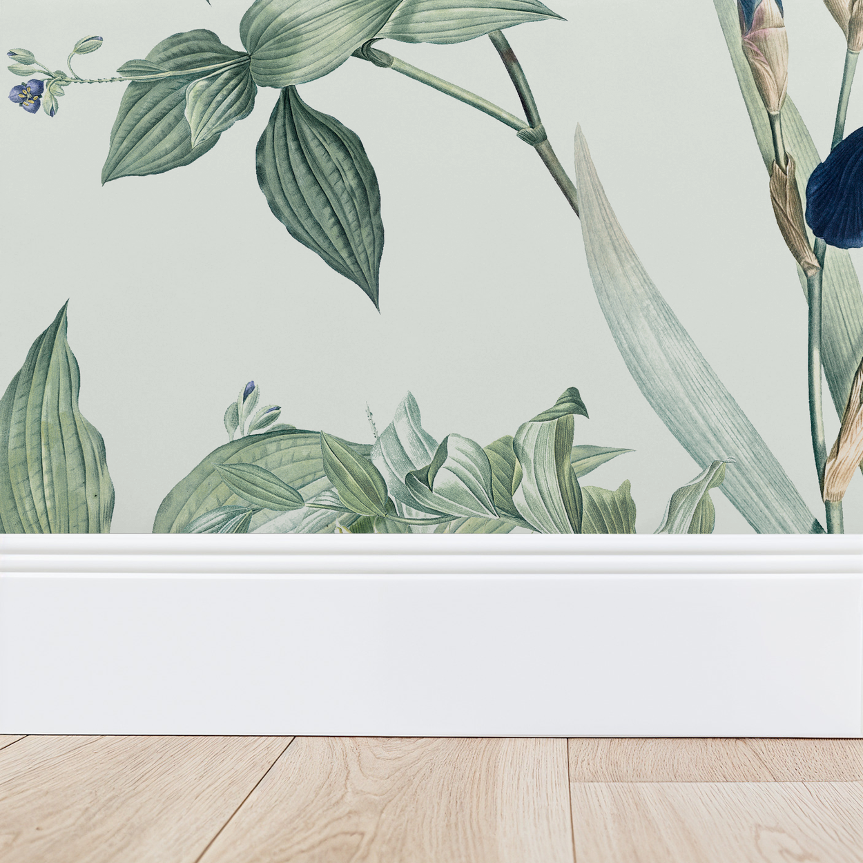 Mint botanical wallpaper with green leaves and blue flowers above white baseboard