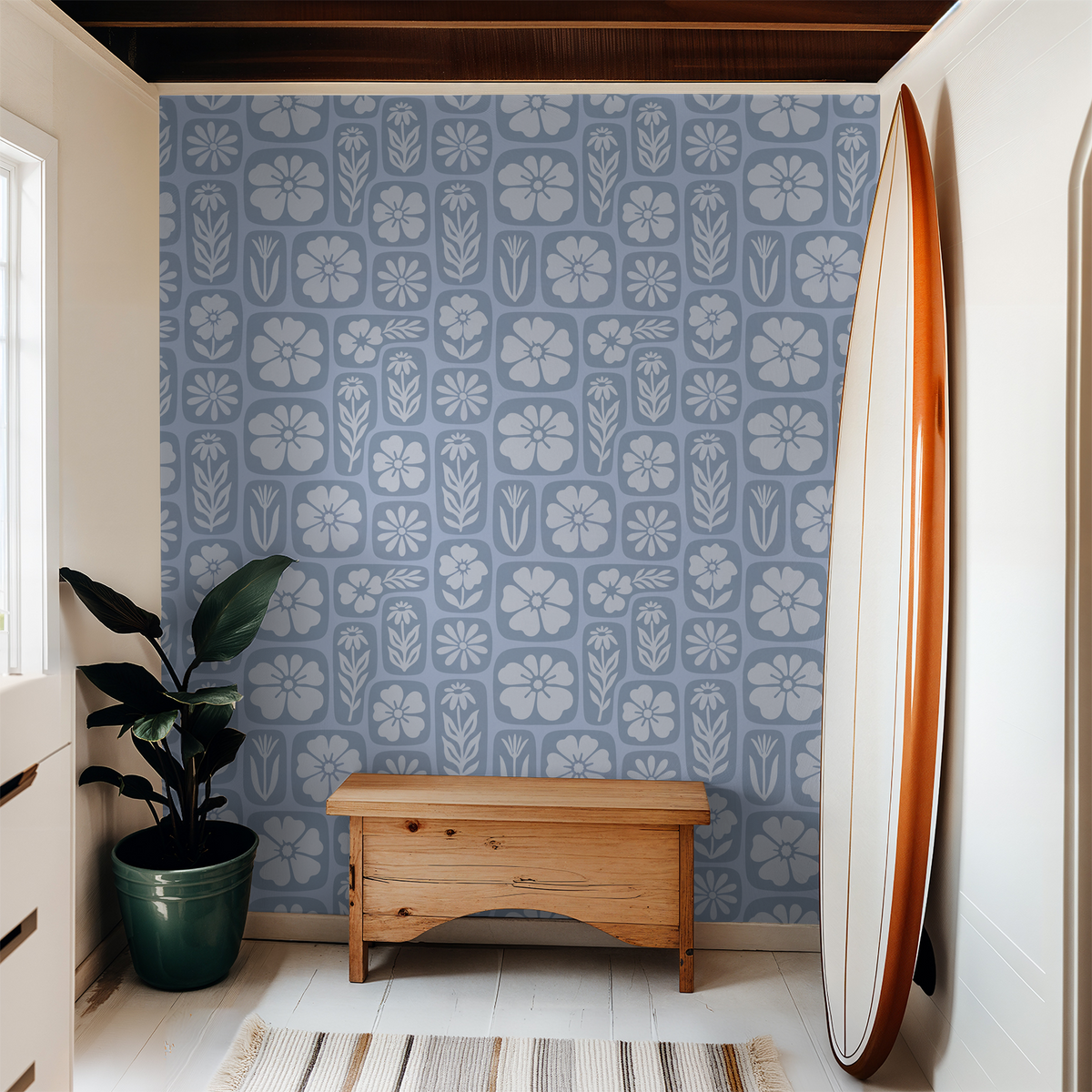 Mono blue floral wallpaper with botanical motifs in a modern room setting.