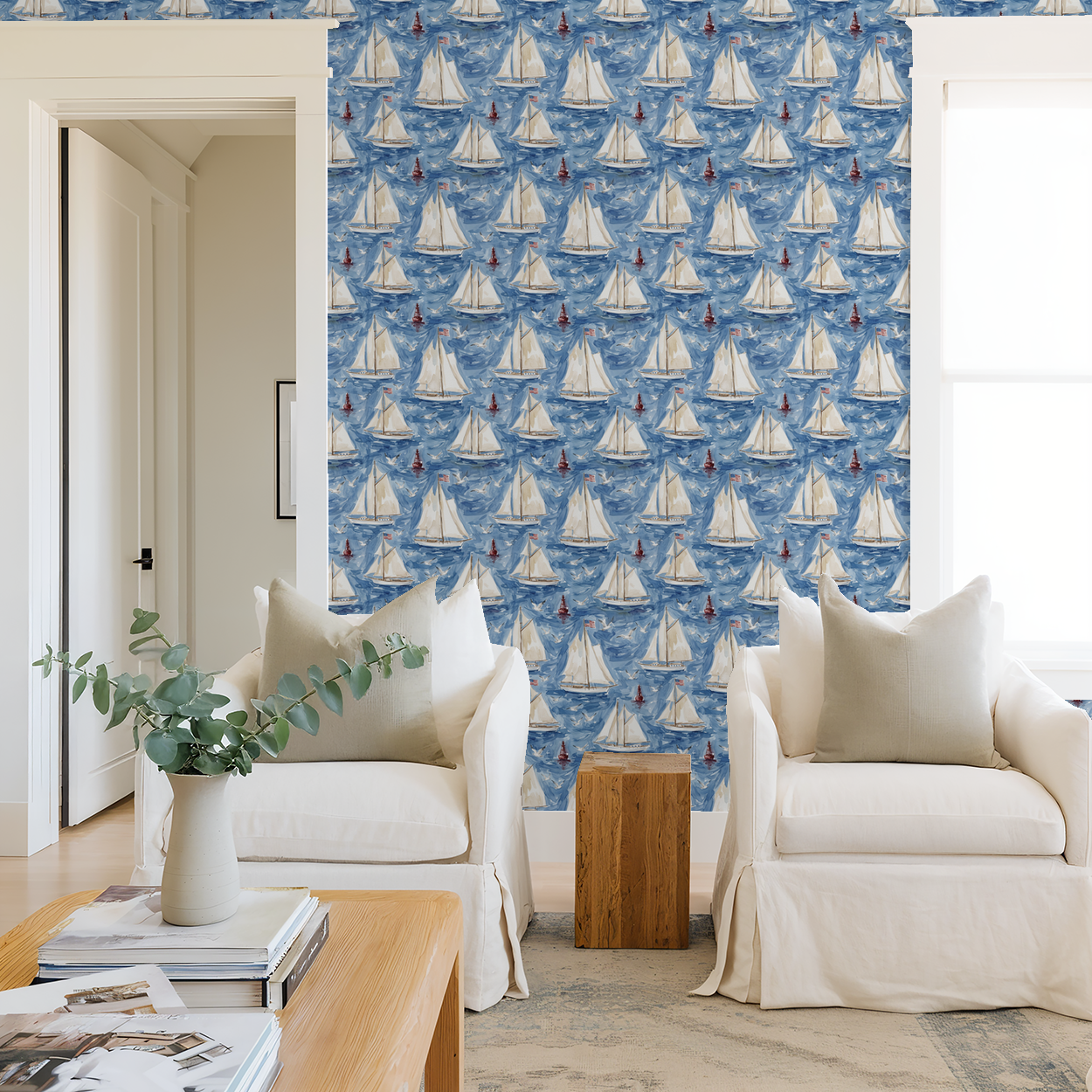 Nautical sailboat wallpaper in blue and white in a cozy living room setting.