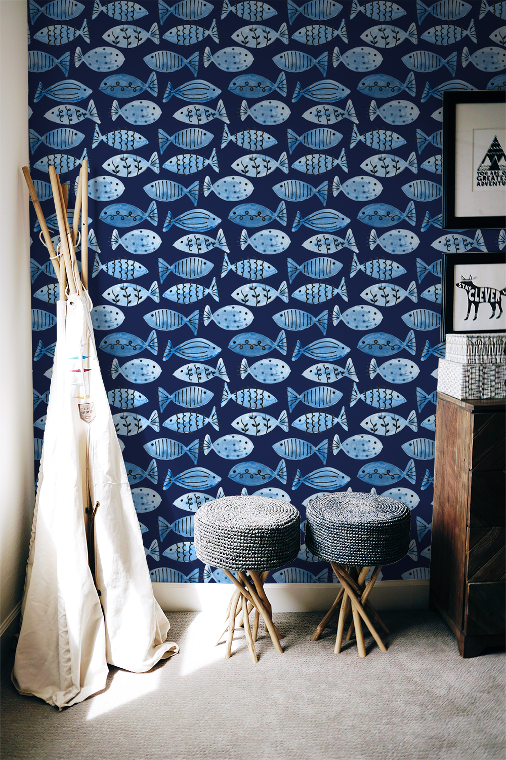 Navy wallpaper with whimsical blue fish pattern in cozy room setting.