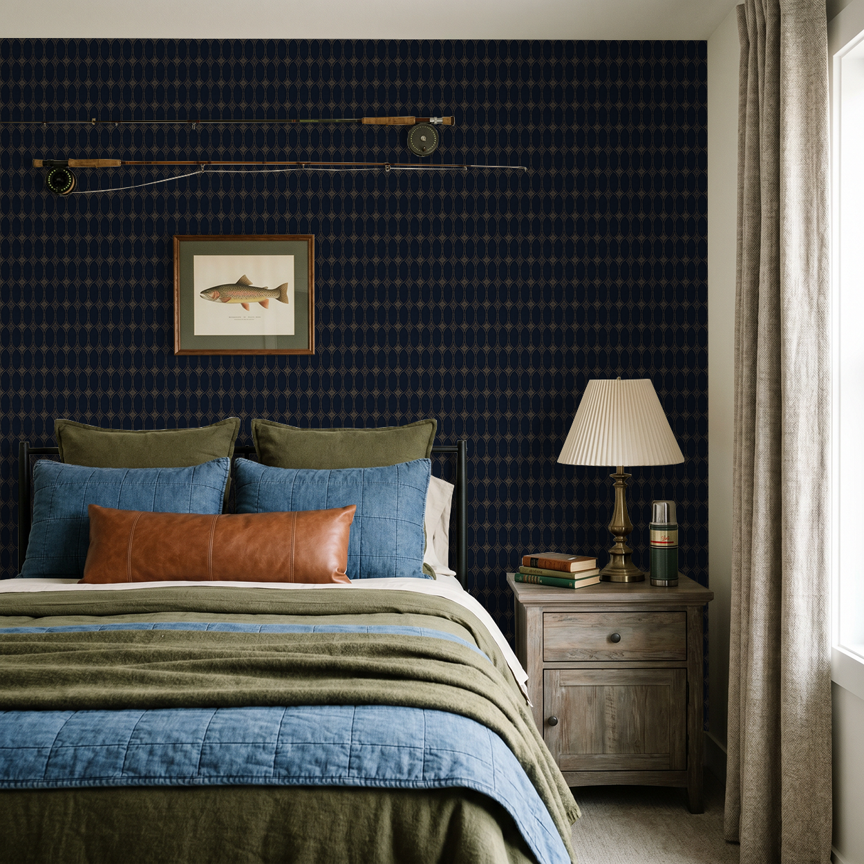 Navy and gold geometric wallpaper in elegant bedroom setting with bed and lamp.