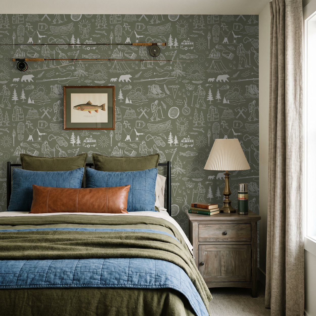 Olive-green wallpaper with white outdoor adventure motifs in cozy bedroom setting.