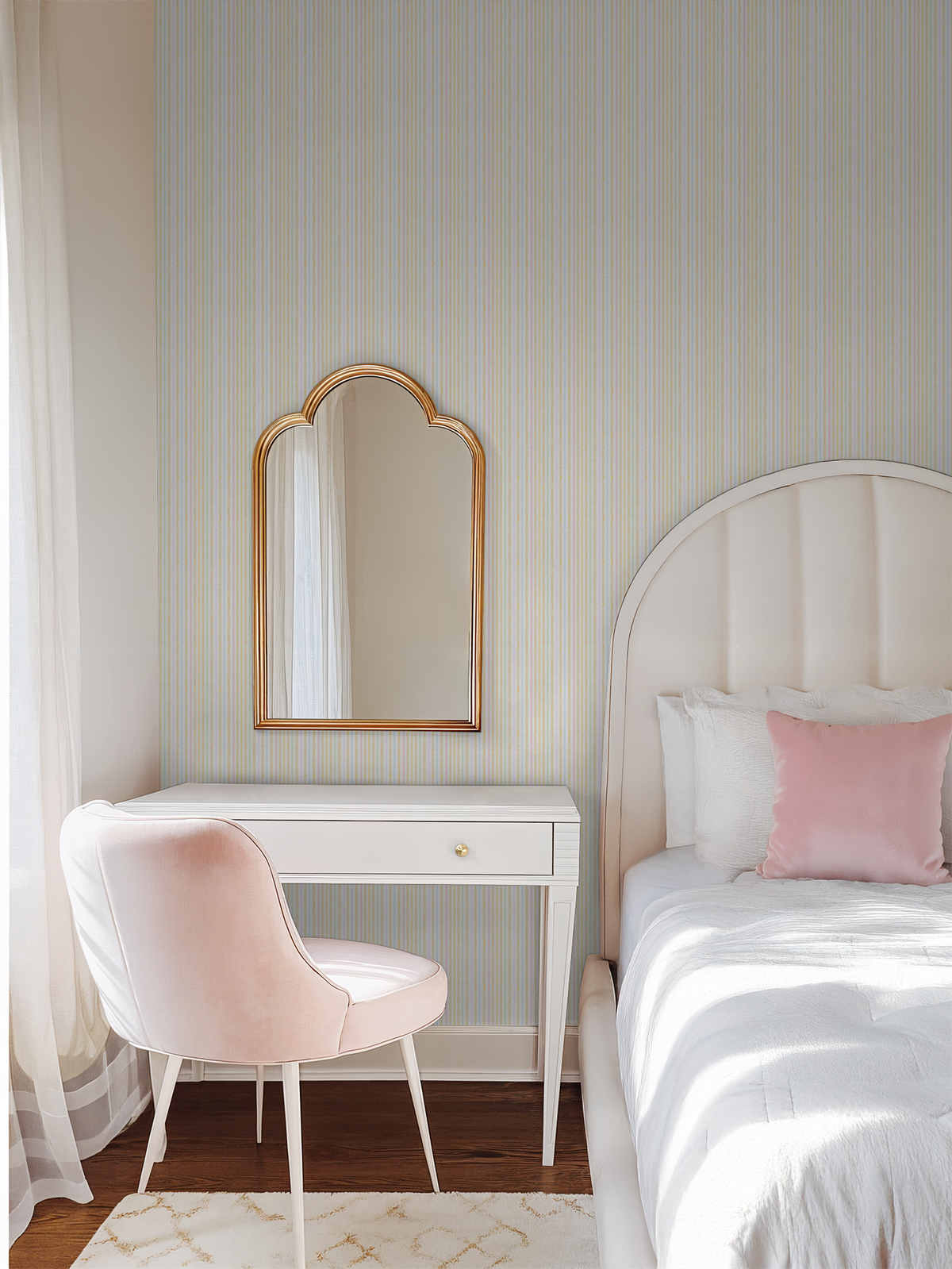 Pastel stripe wallpaper in a vintage bedroom with a white desk and pink chair.