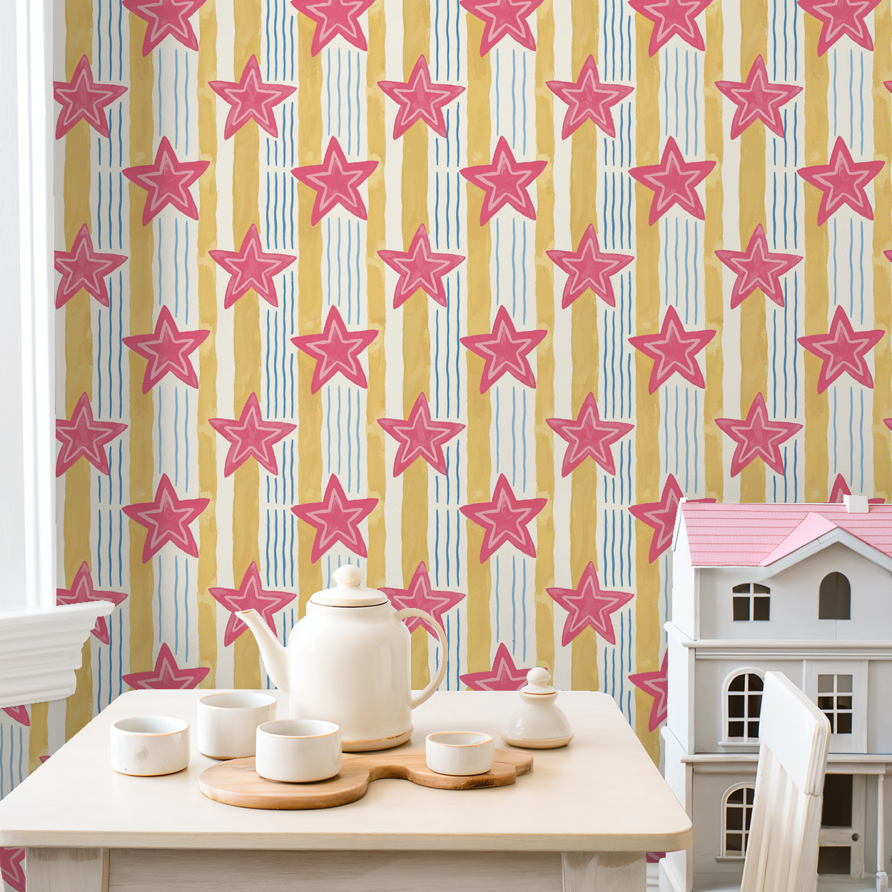 Pink star wallpaper with yellow and blue stripes in a playful room setting.