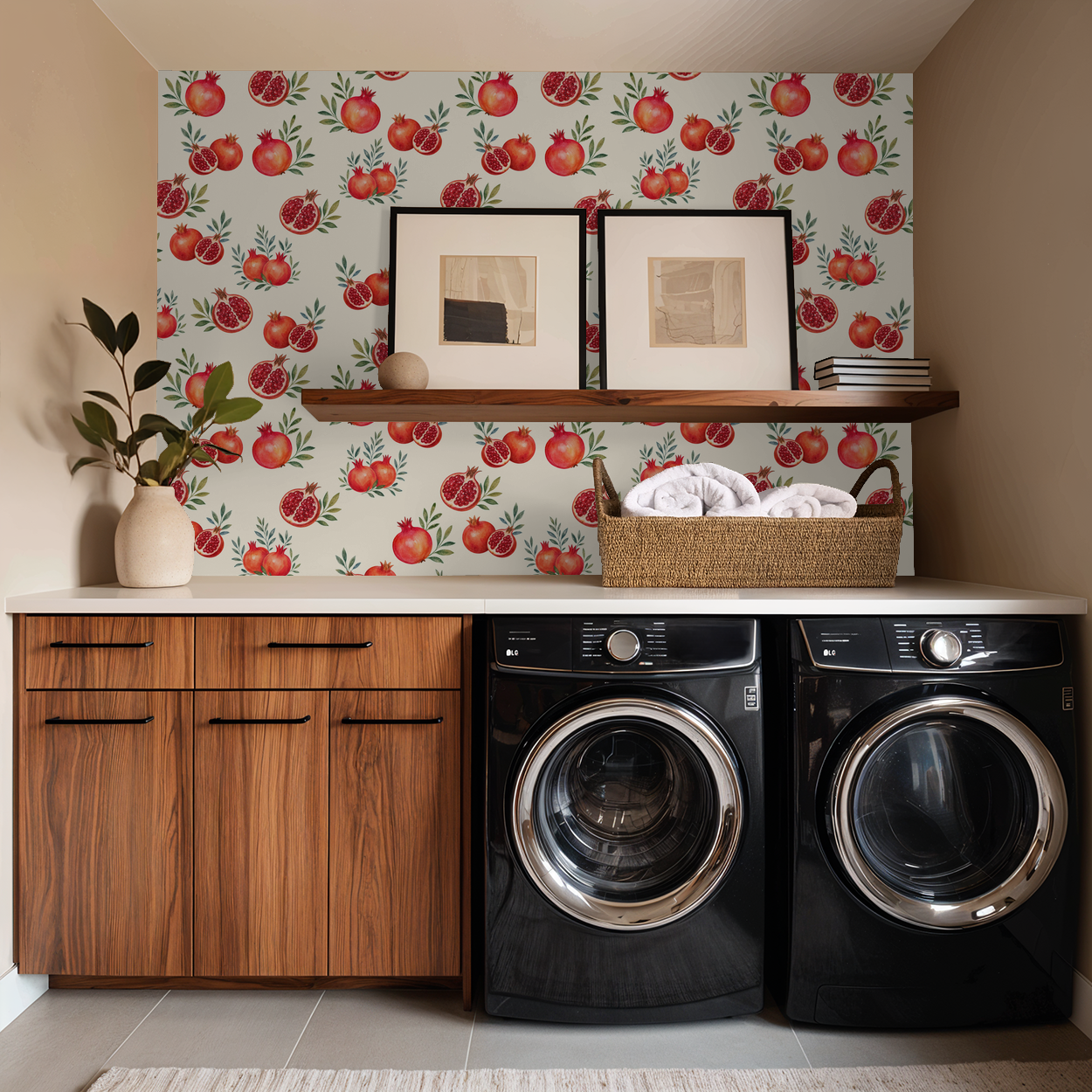 Laundry room with pomegranate wallpaper, wooden cabinets, and black appliances.