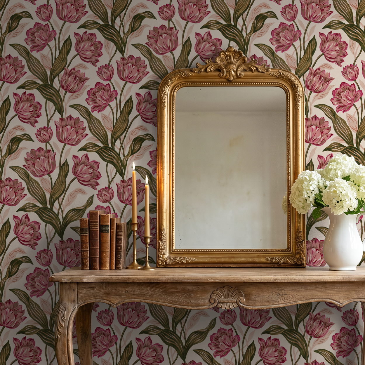 Provence wallpaper with pink blooms and green leaves behind ornate mirror and wooden table.