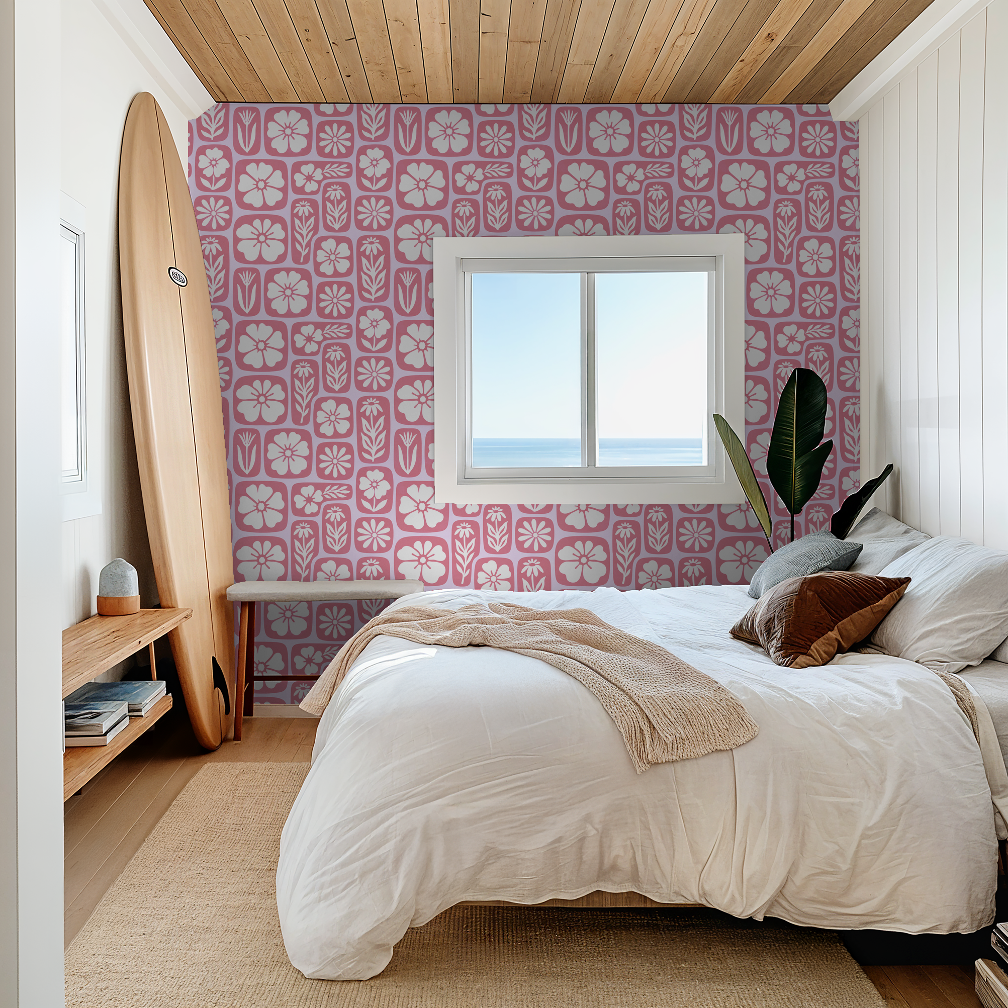 Retro pink floral wallpaper in a cozy bedroom with surfboard decor.
