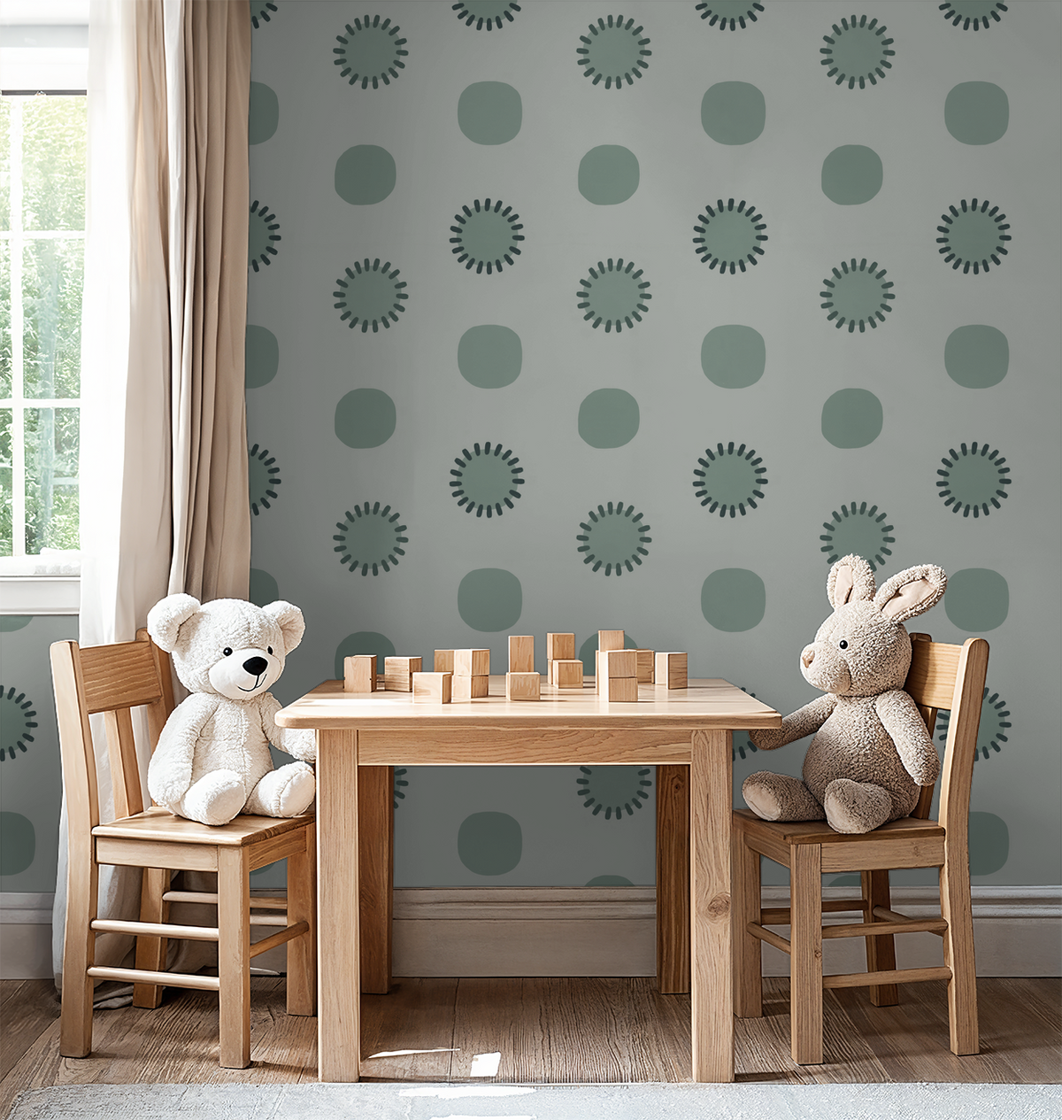 Sage green and charcoal circle pattern wallpaper in a child's playroom with wooden furniture.