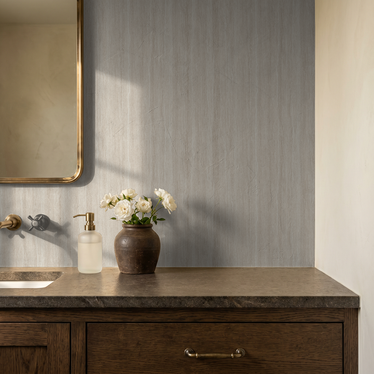 Serene Streaks wallpaper in beige and cream with a vase on a wooden countertop in a bathroom.