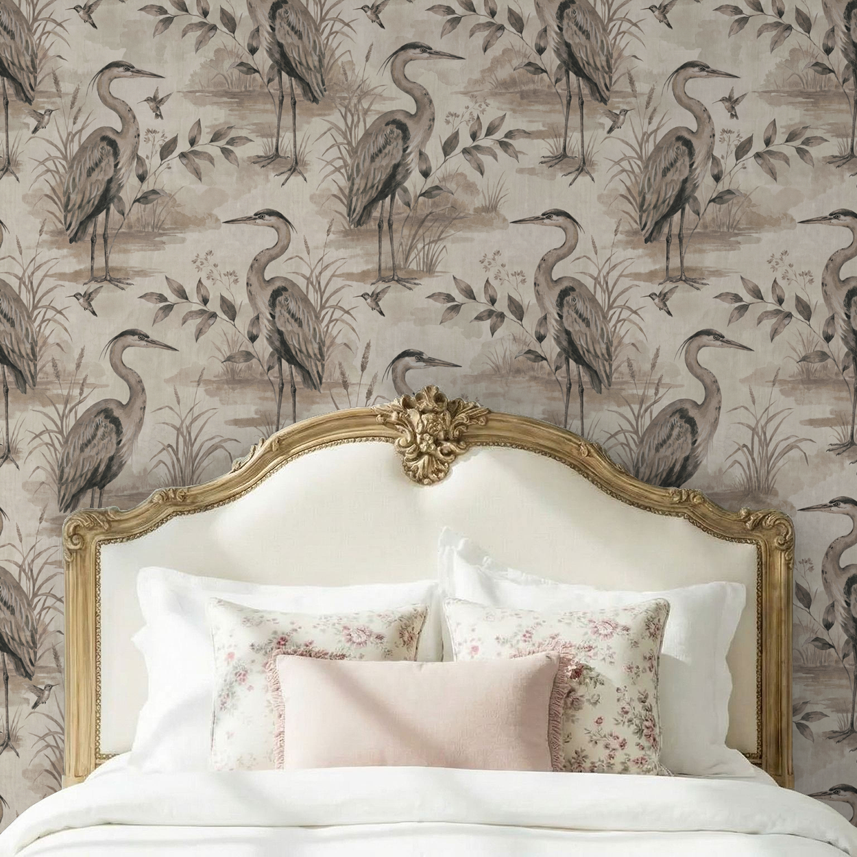 Taupe heron wallpaper with foliage behind ornate bed in elegant bedroom.
