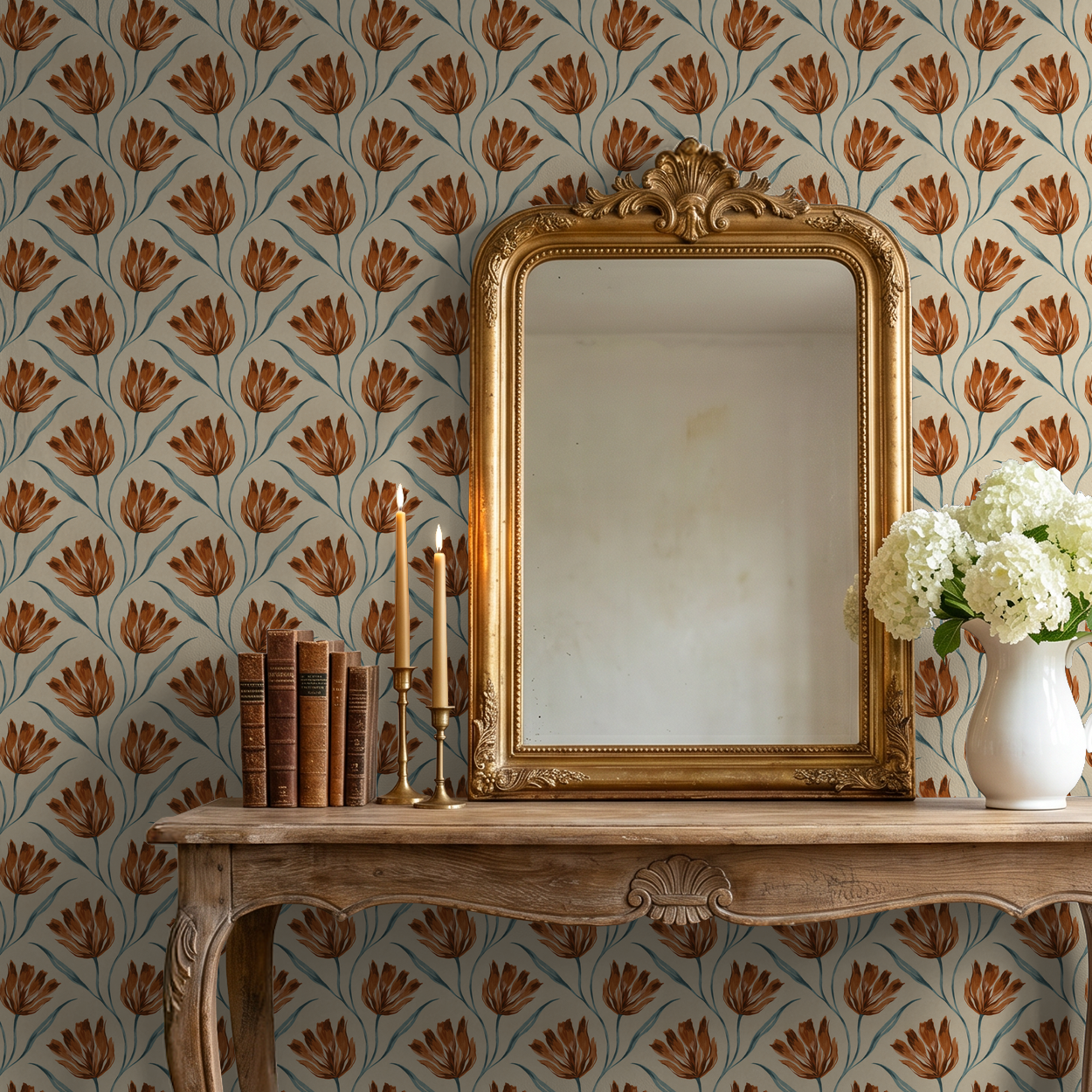 Terracotta floral wallpaper with gold mirror and vase in elegant room.