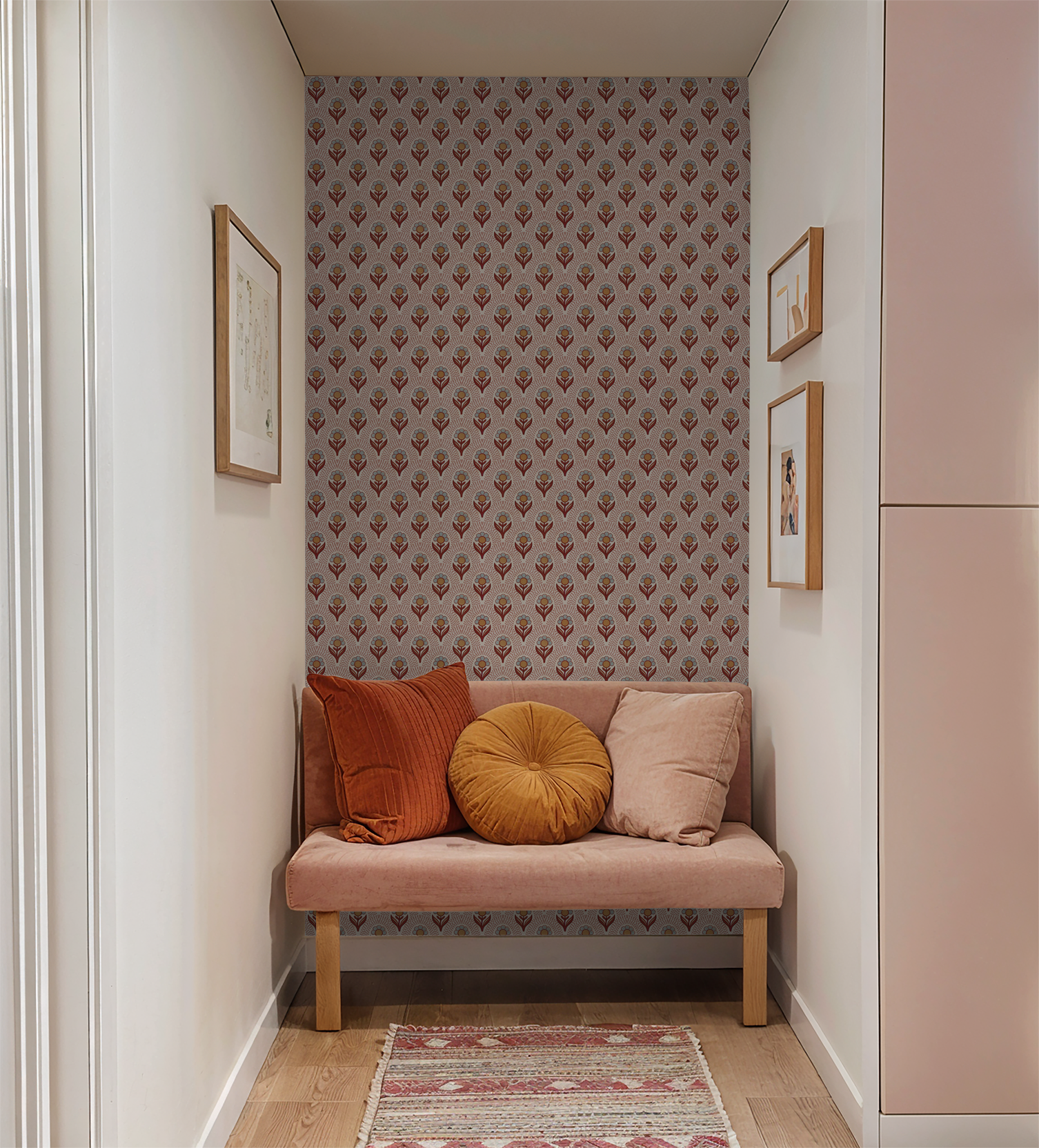Vintage floral wallpaper with rust and ochre tones in cozy nook with cushions.