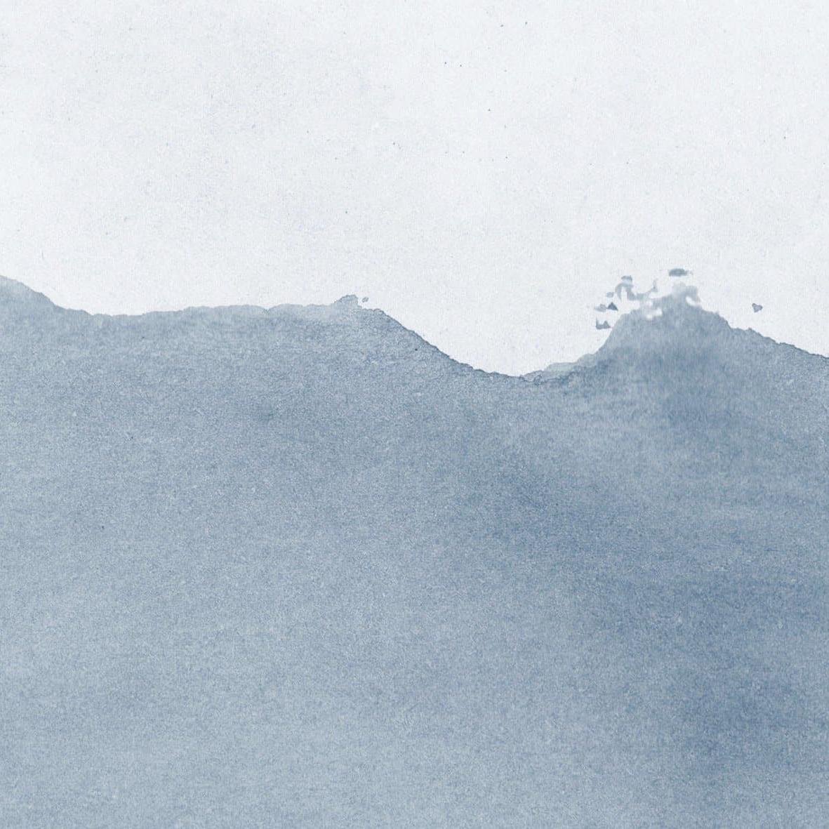 Textured 'The Wembly Wallpaper' by Wall Blush in a minimalist style room, highlighting elegant home decor.