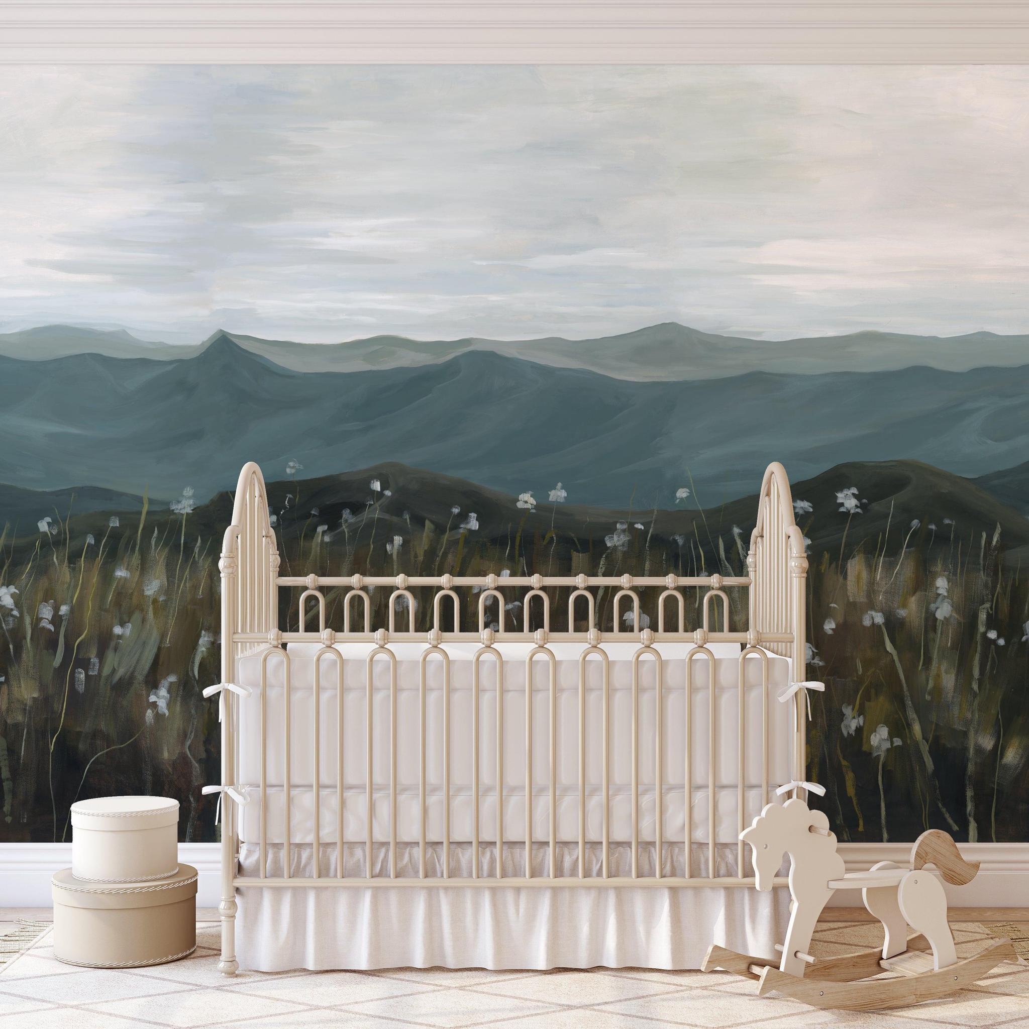 On the Horizon Wallpaper by The David Brazier Line in a stylish nursery room with a focus on the scenic wall decor.