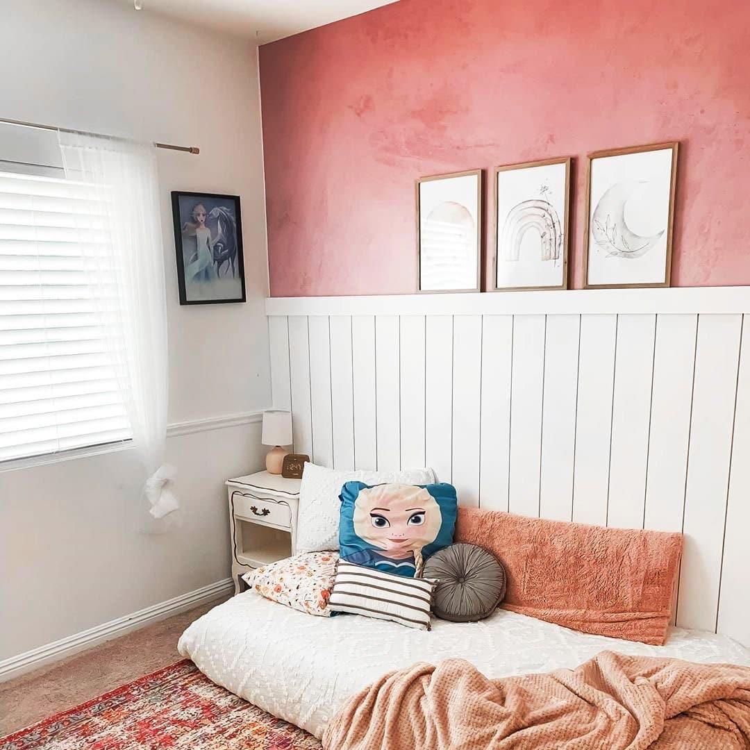 Wall Blush Rosemary Wallpaper featured in cozy bedroom decor with a focus on the textured pink accent wall.