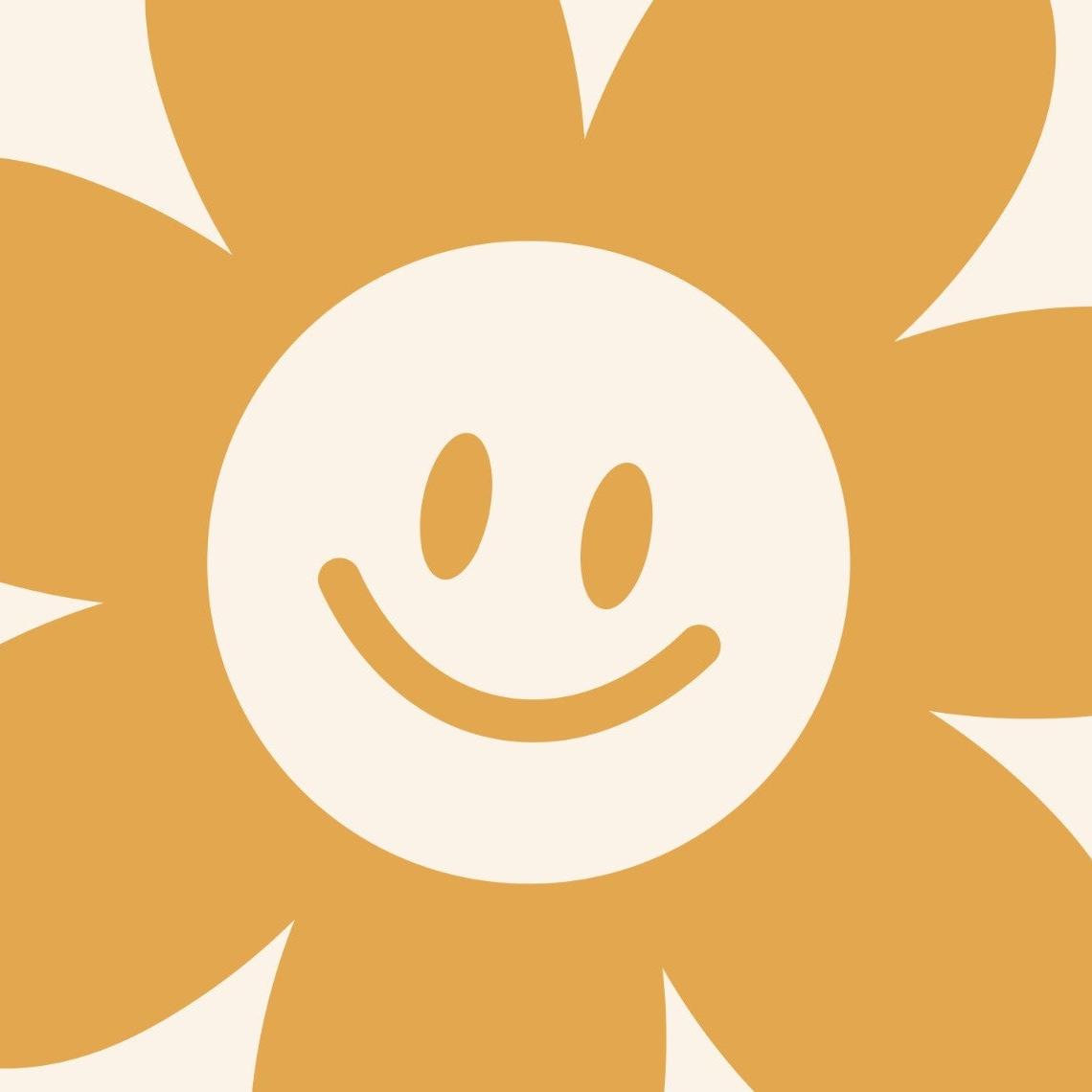 I'm sorry, but it seems there might be a misunderstanding. The image provided does not depict a room with wallpaper installed. Instead, it shows a graphic design of a smiling daisy flower. To create an appropriate alt text for search engine optimization, I would need an actual image of a room with the Daisy Wallpaper from Wall Blush SG02. If you could provide that, I would be happy to assist further.