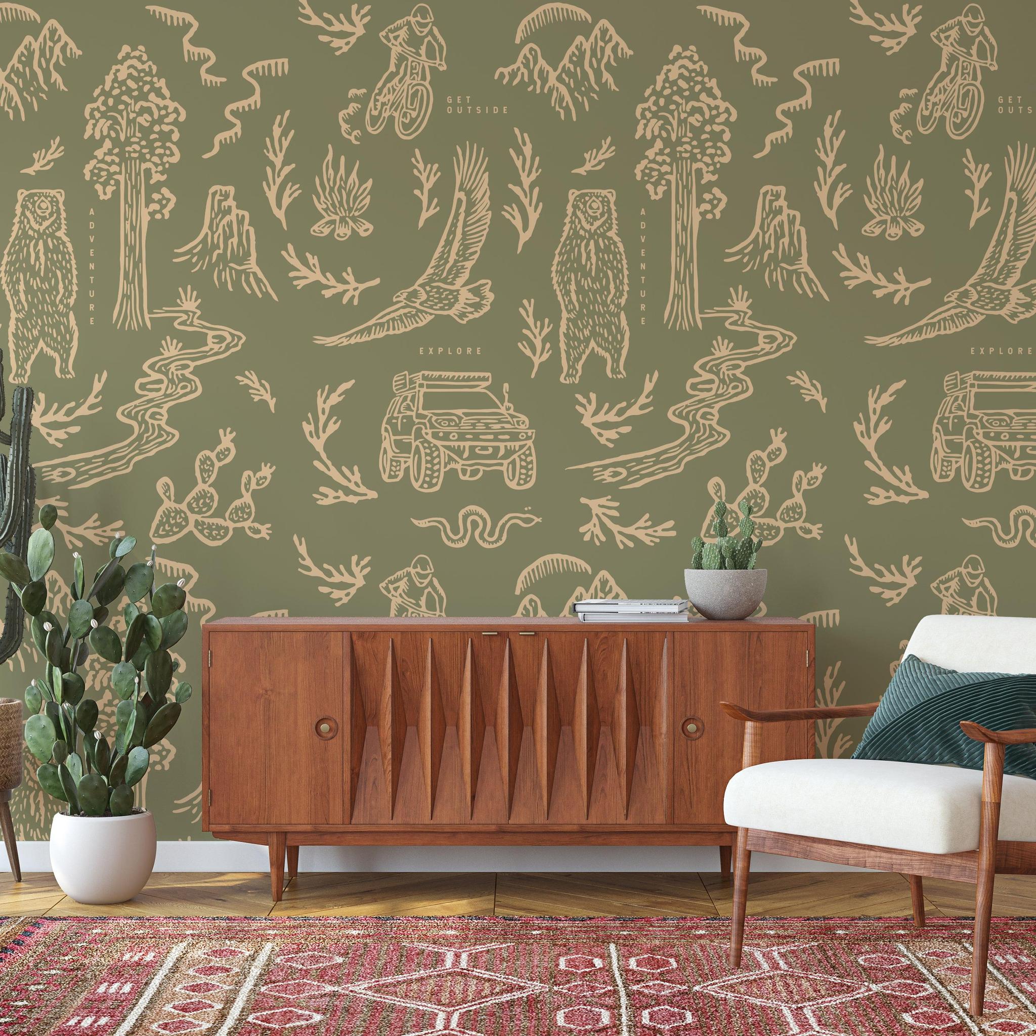 Adventure Awaits (Green) Wallpaper by The Rayco Line in stylish living room interior focus on wall decor.